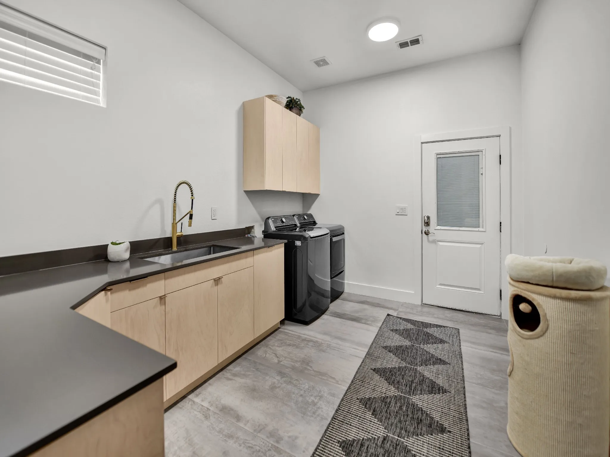 Spacious laundry room with sink