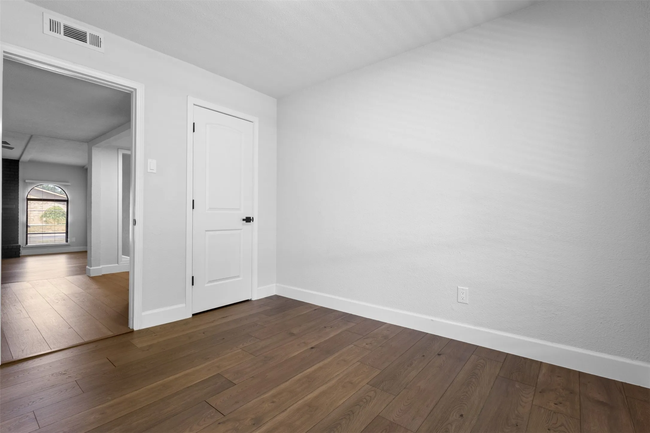 Wood-finish plank flooring throughout