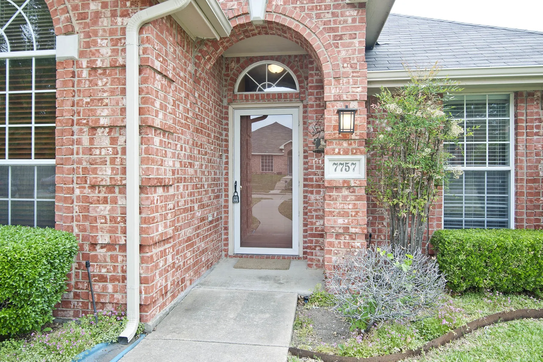 Property entrance with brick siding