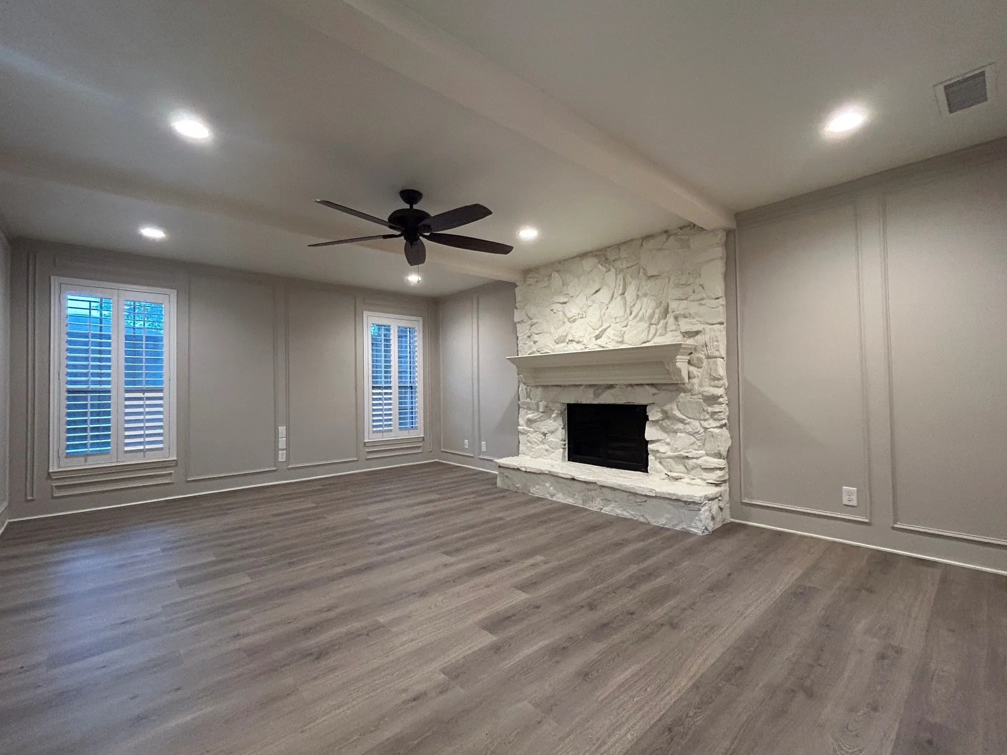 The large living room has been freshly painted and has new flooring.