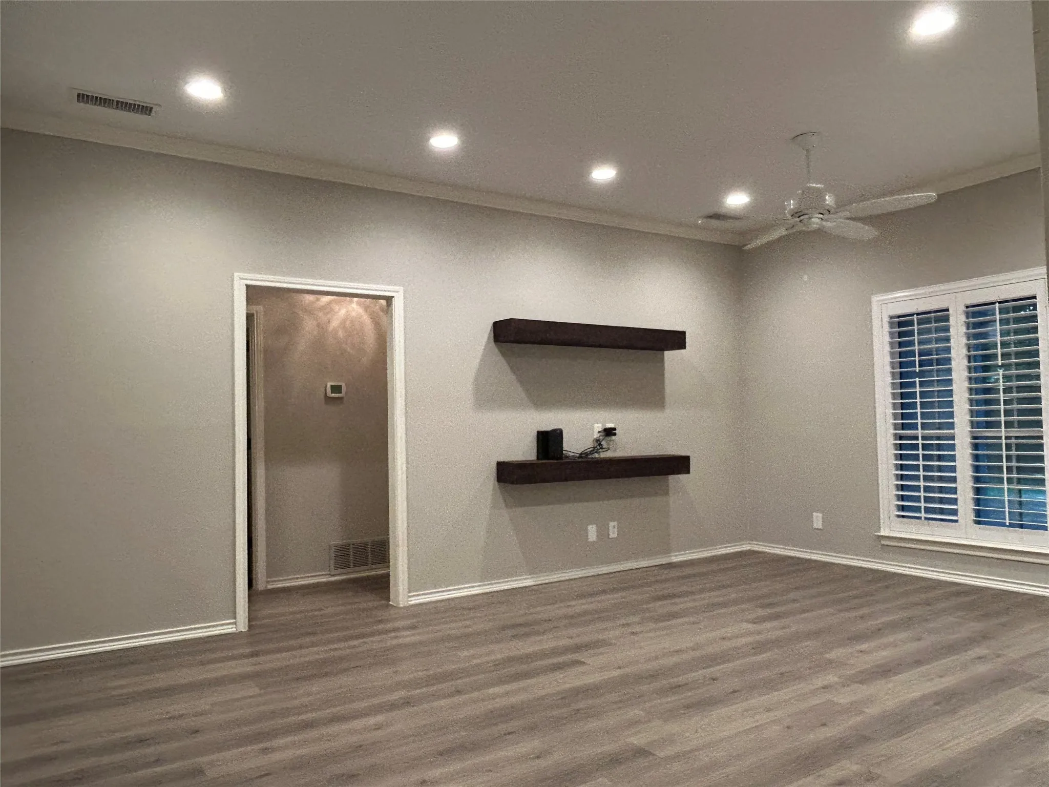 The family room has fresh paint and new flooring.