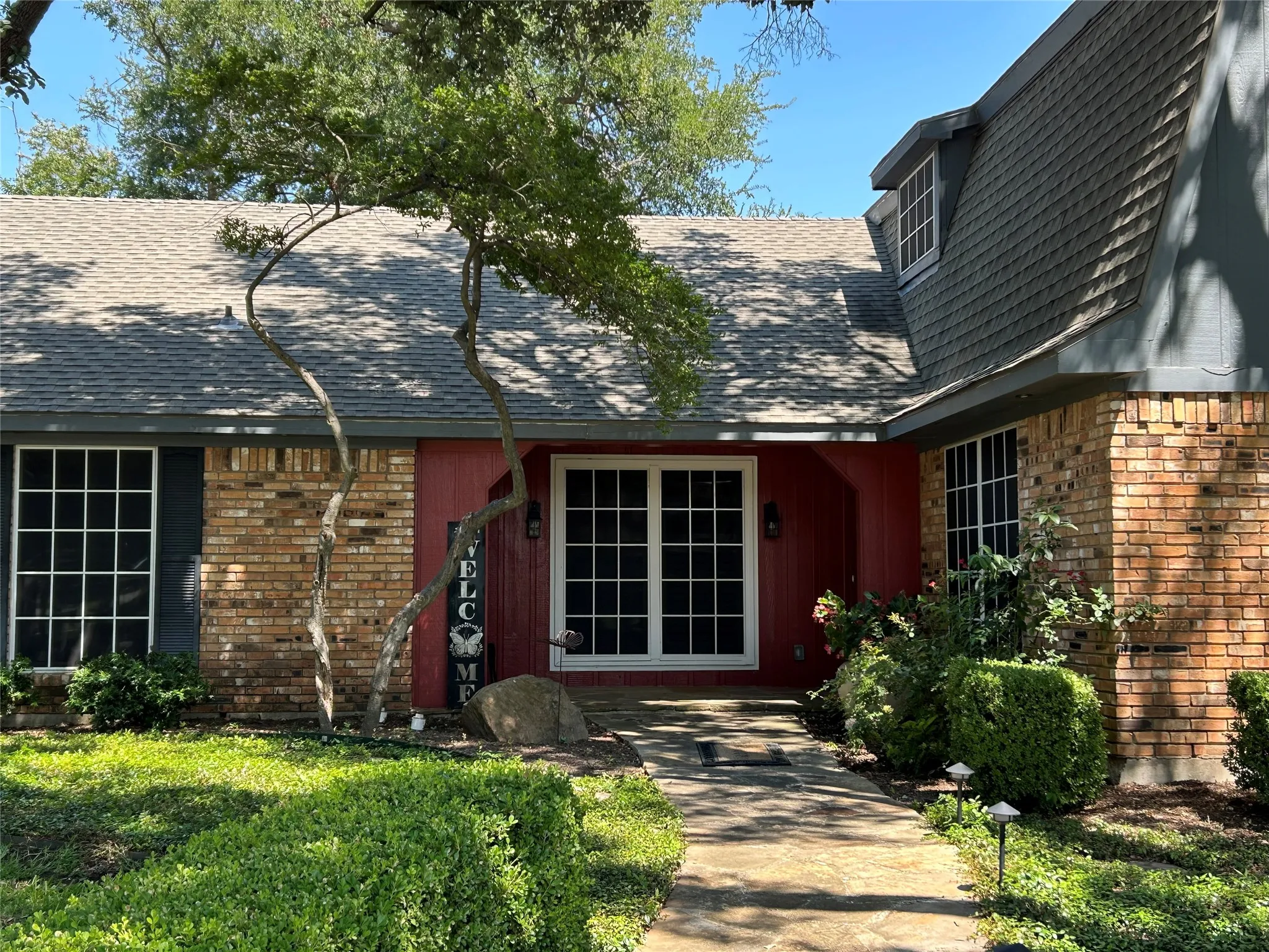 The entry welcomes you with a covered porch perfect for chairs or a bench.