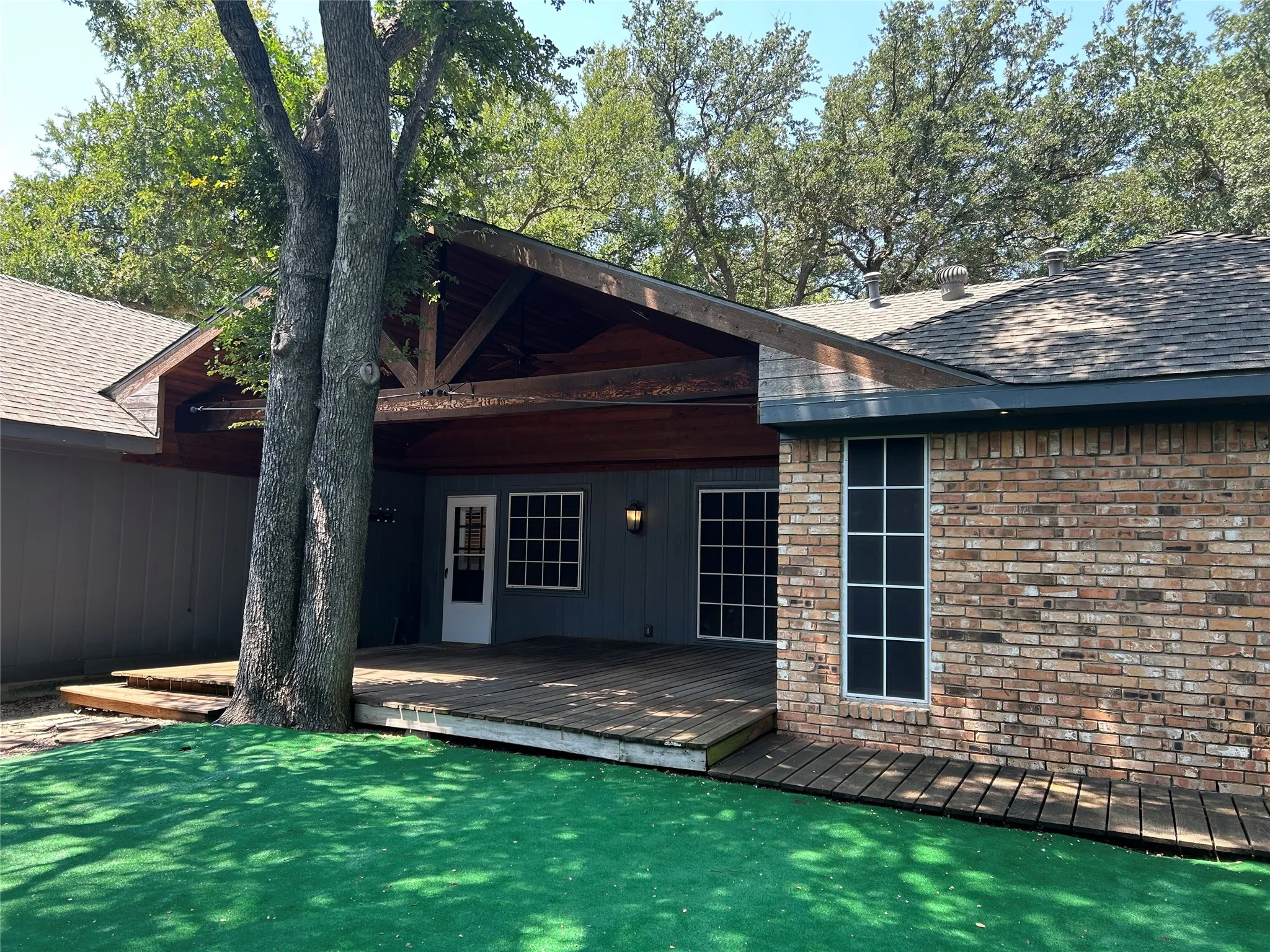 The back has a large covered deck ideal for entertaining and relaxing.