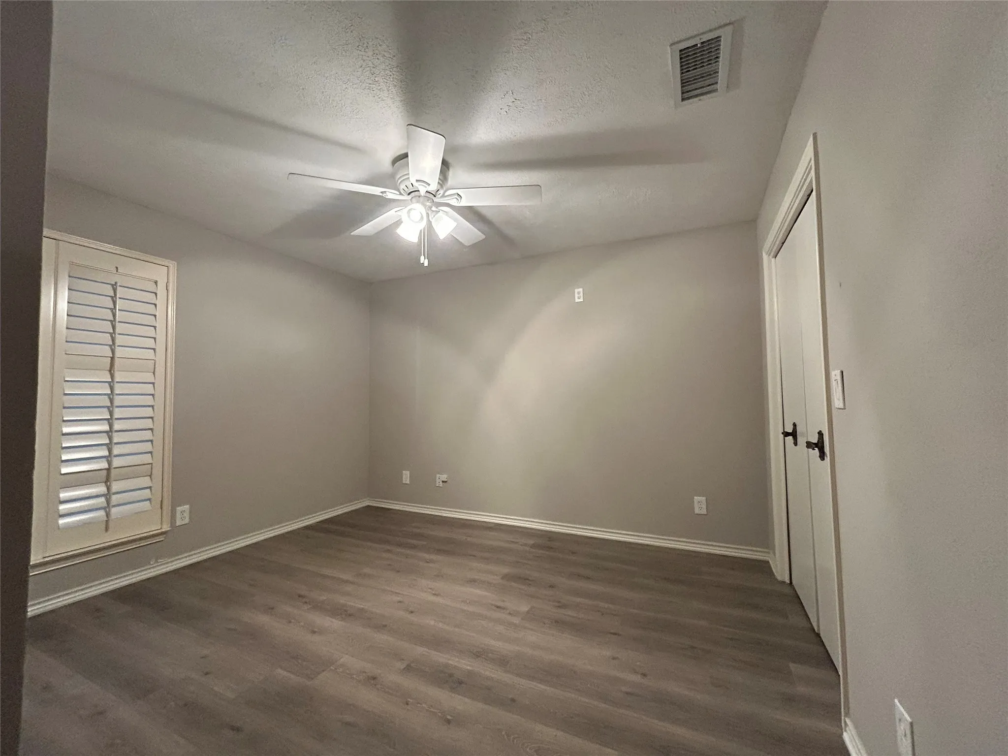The large second bedroom on the first floor is ideal for an office or guest room.