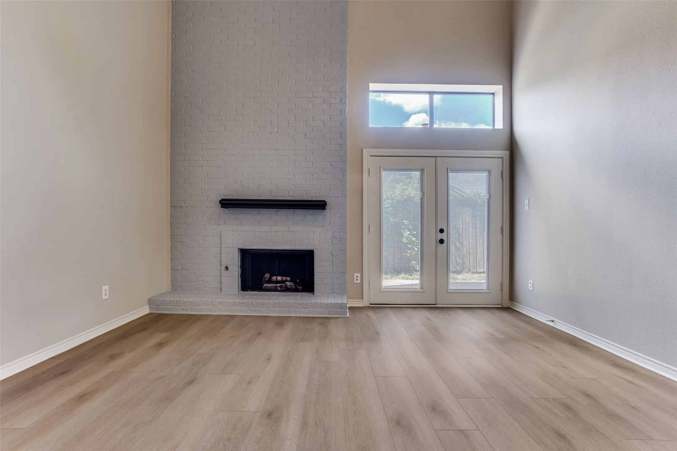 Vaulted ceilings with wood-finish flooring