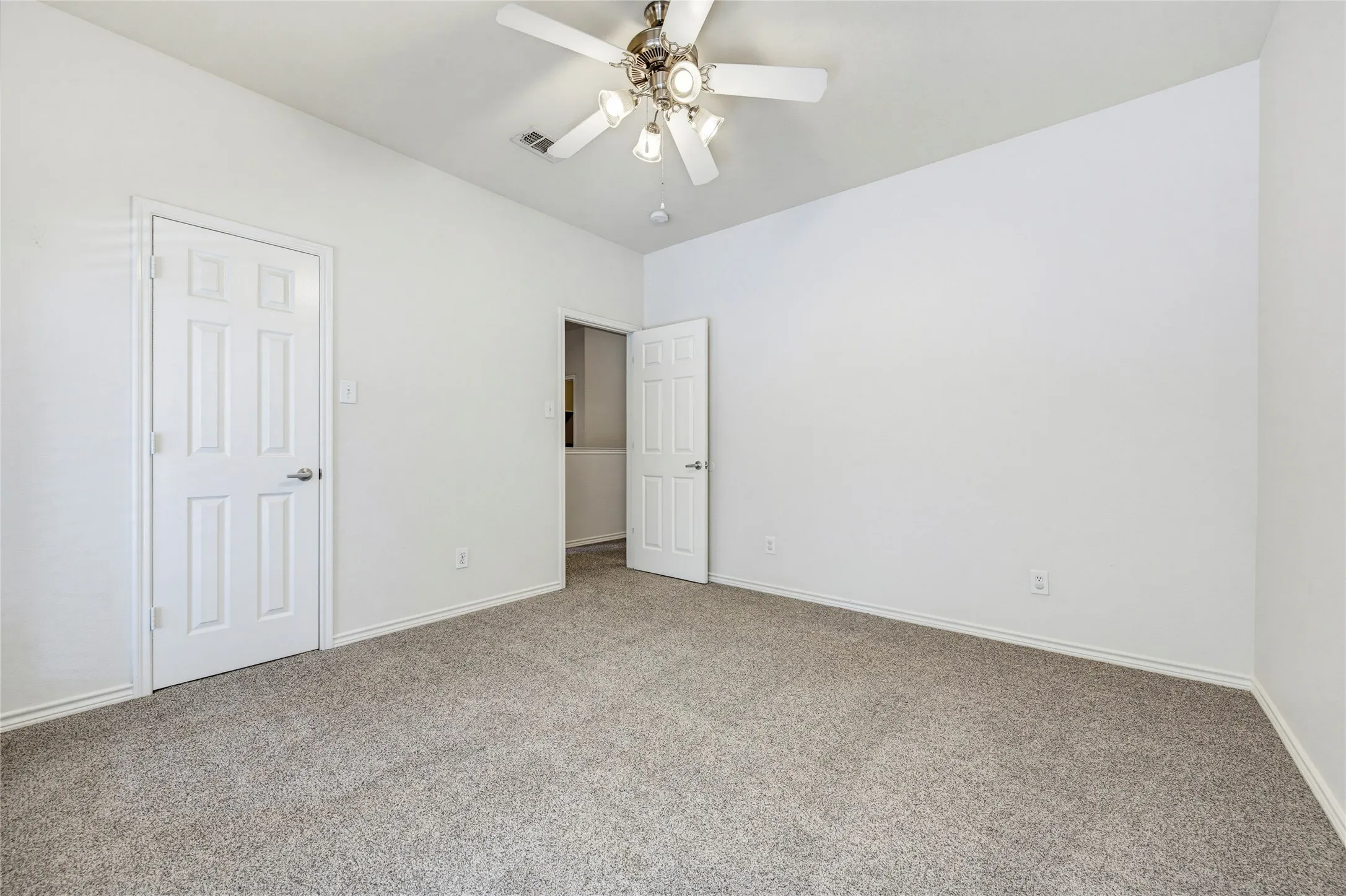 Upstairs bedroom with ceiling fan, and neutral finishes ready for any style.
