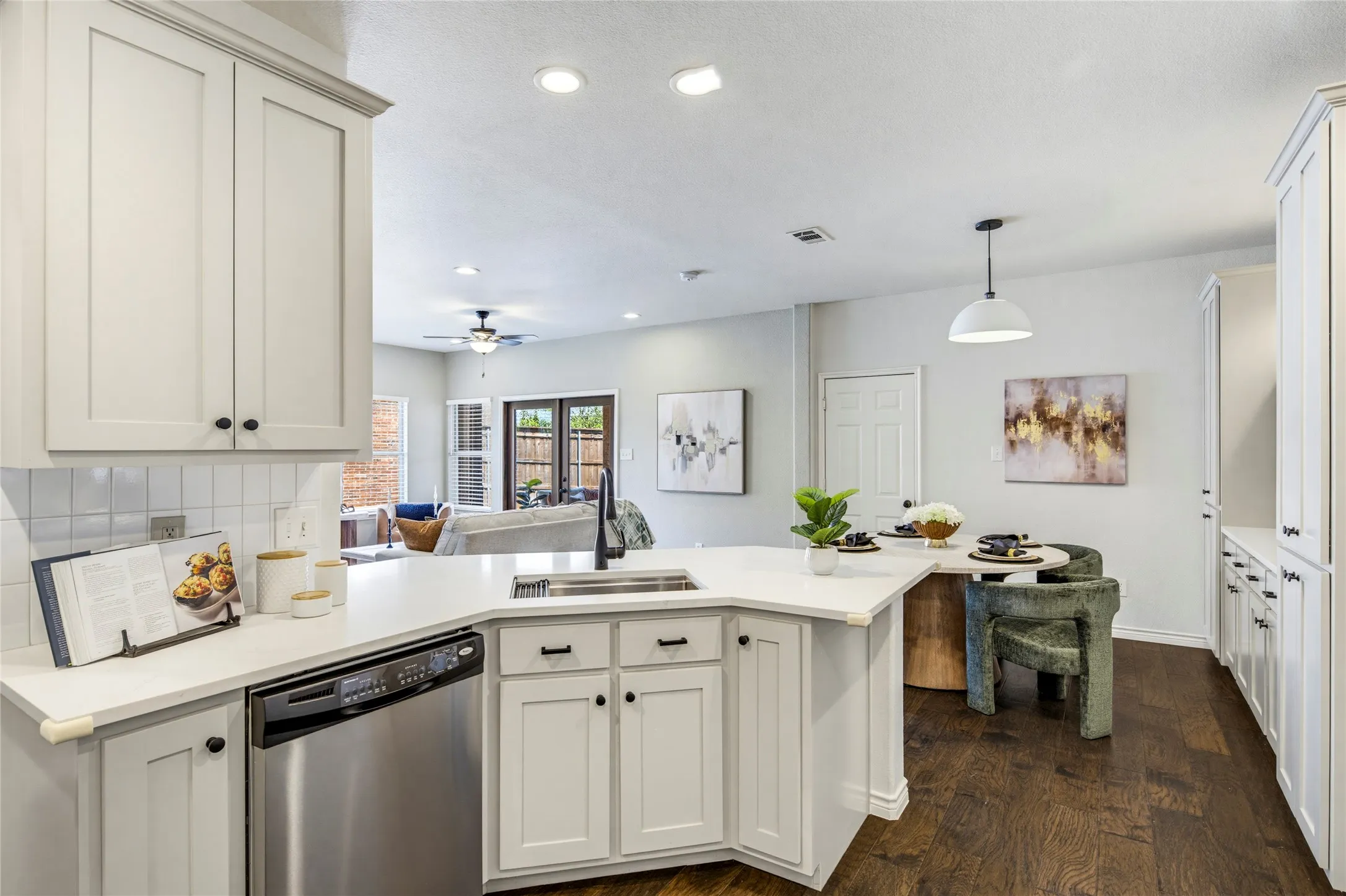 The open layout connects the kitchen to the breakfast area and living room, so hosting feels effortless from prep to plate.