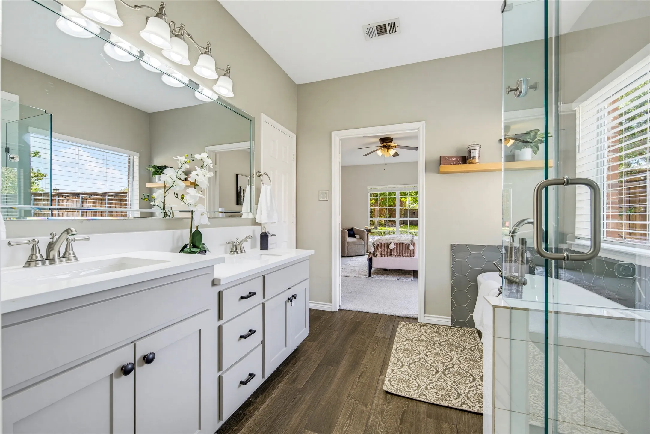 Dual sinks, generous counter space, and a refreshed modern design mean no one has to share the mirror.