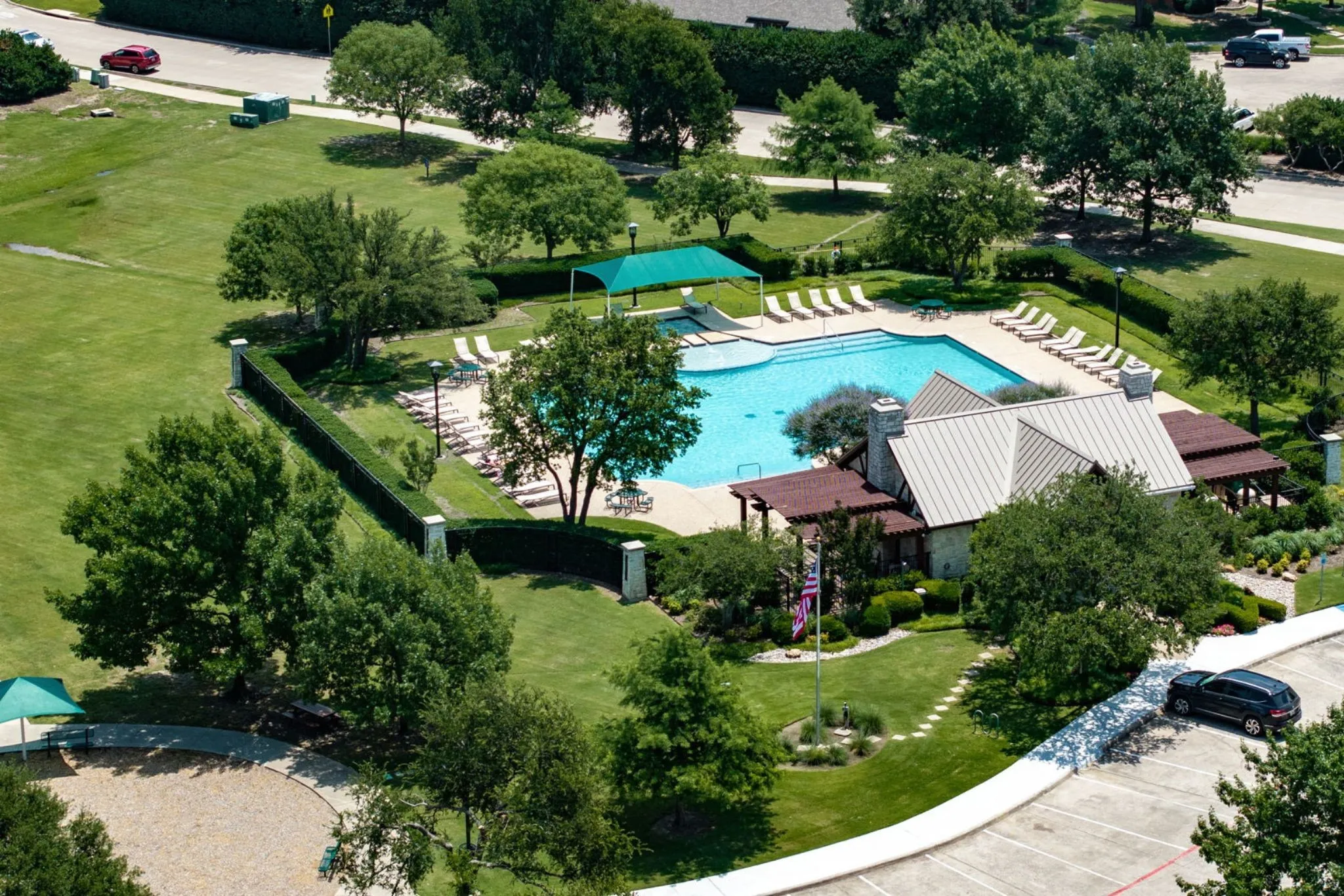 One of two community pools included with the HOA, surrounded by green space for easy summer afternoons.
