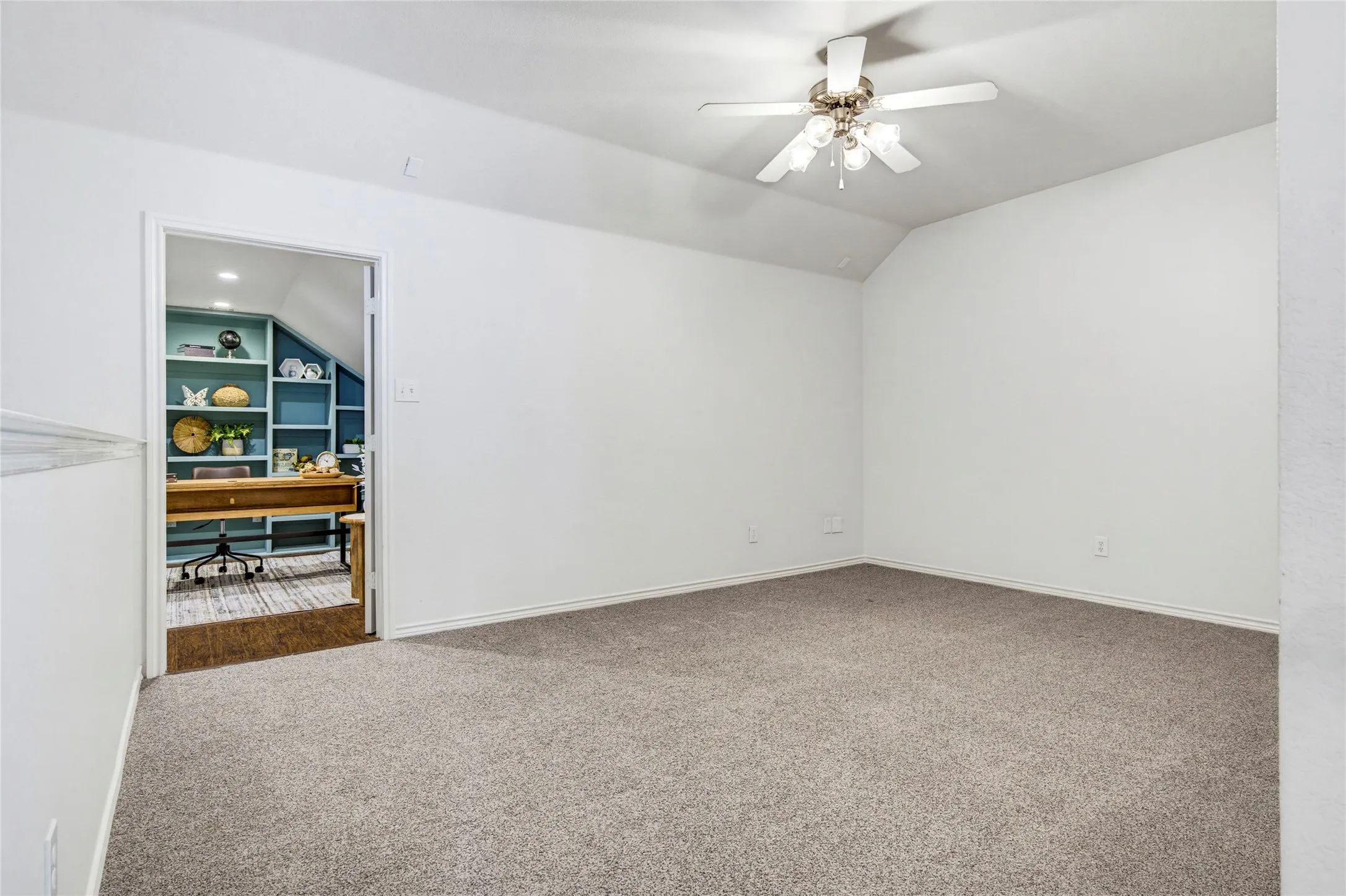 Plenty of room for a sectional, game table, or both, with double doors leading into the home office.