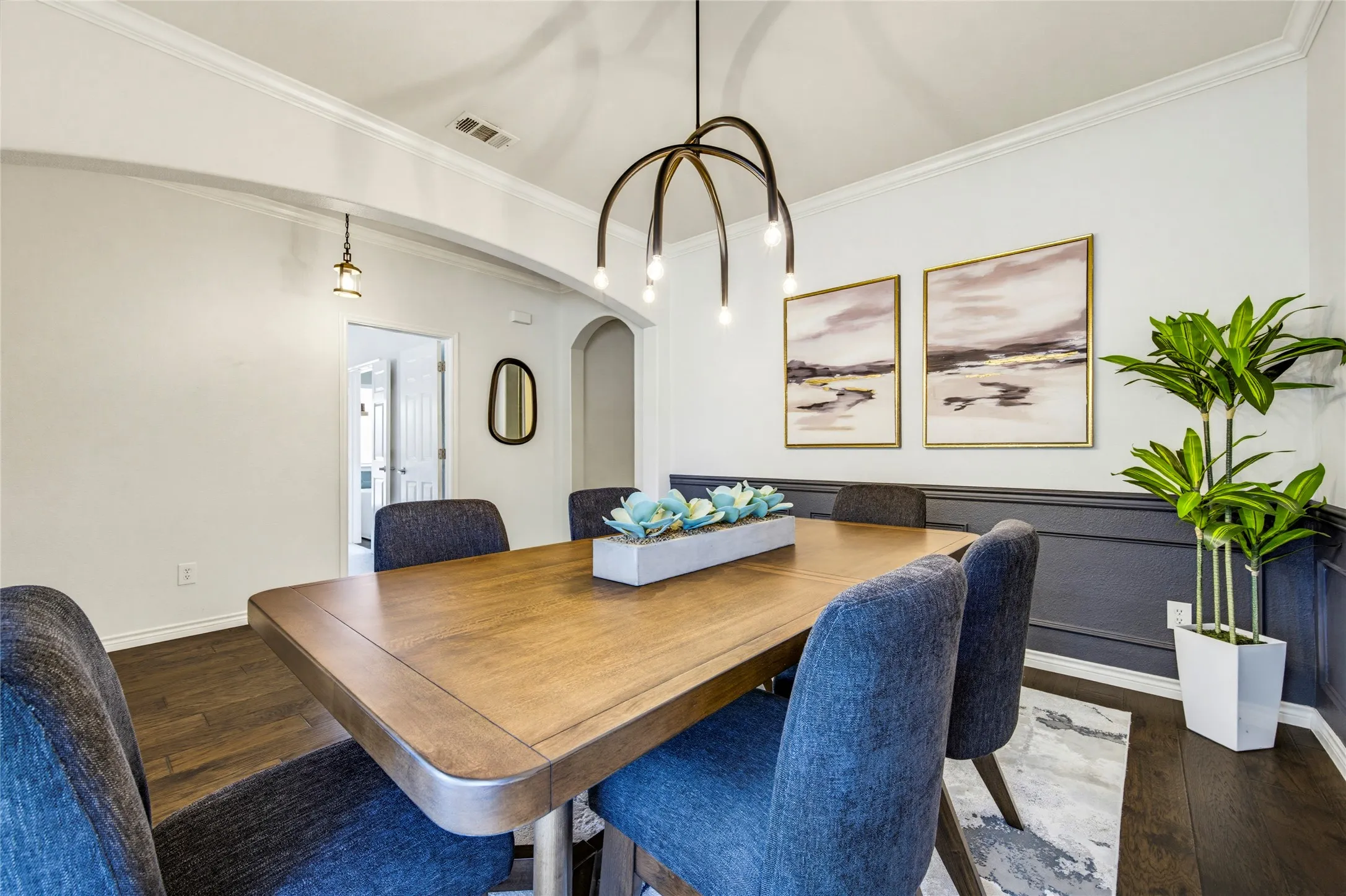 A statement chandelier and dramatic two-tone walls give the formal dining room real personality. Dinner parties just got an upgrade.