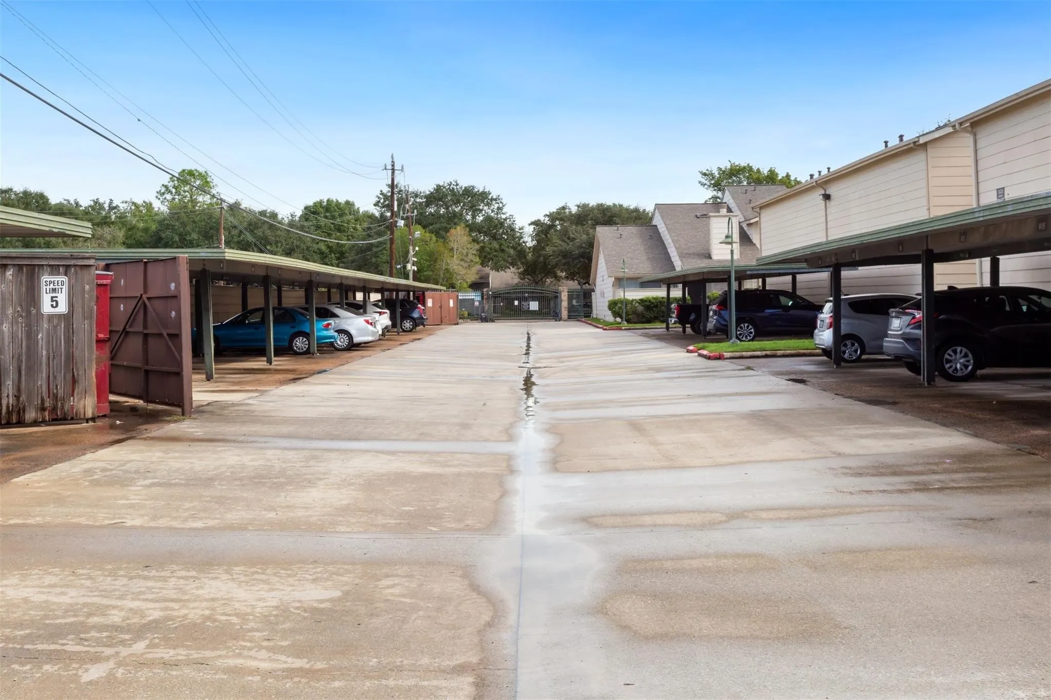 Covered parking structure with multiple spaces and a concrete driving surface
