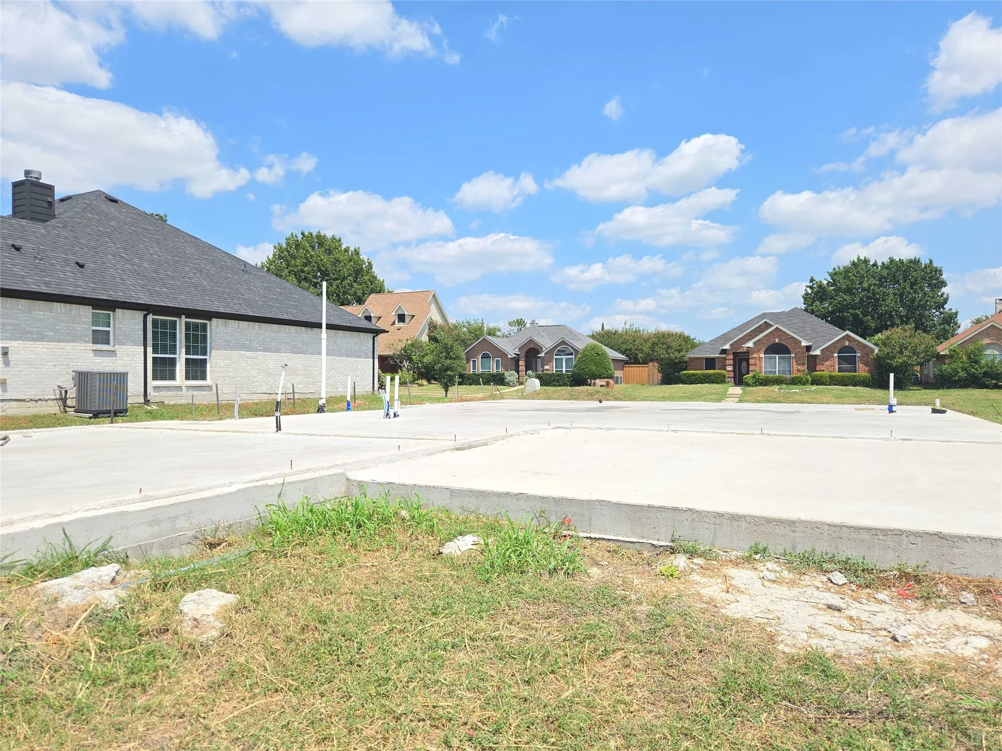 Concrete slab foundation with visible plumbing rough-ins