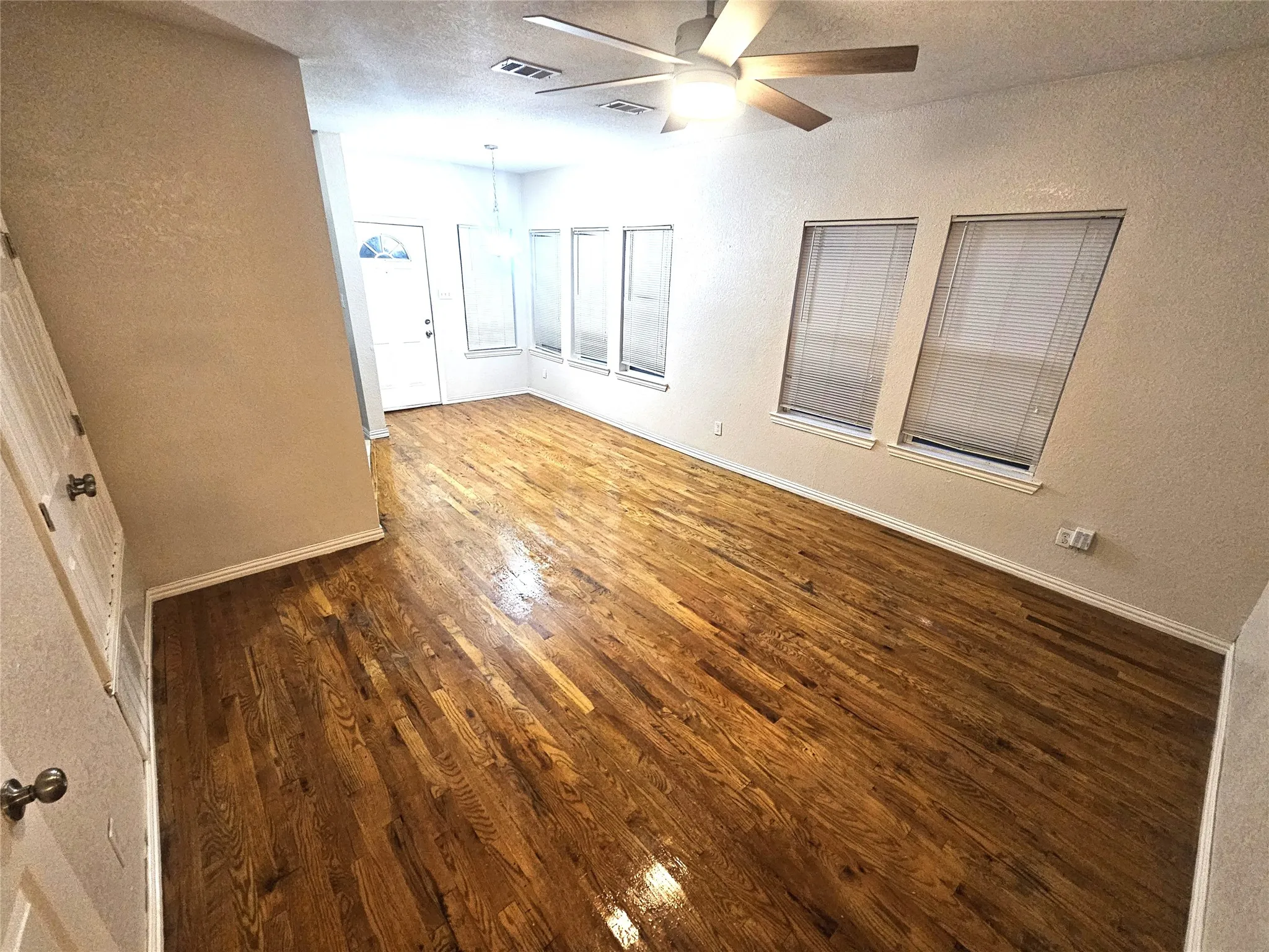 family room and dining area (showing the backdoor)