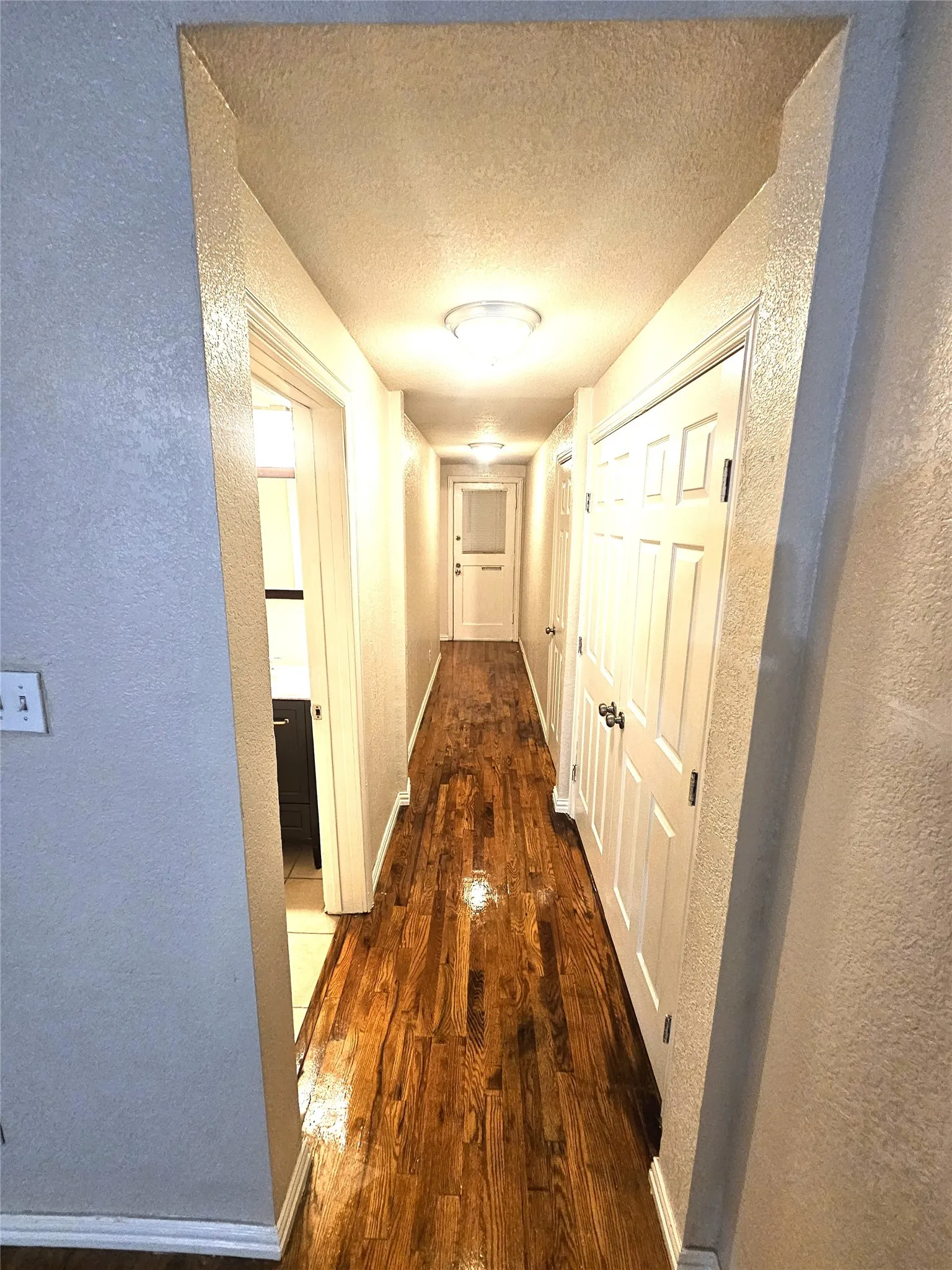 hallway towards 2 bedrooms and full size bathroom