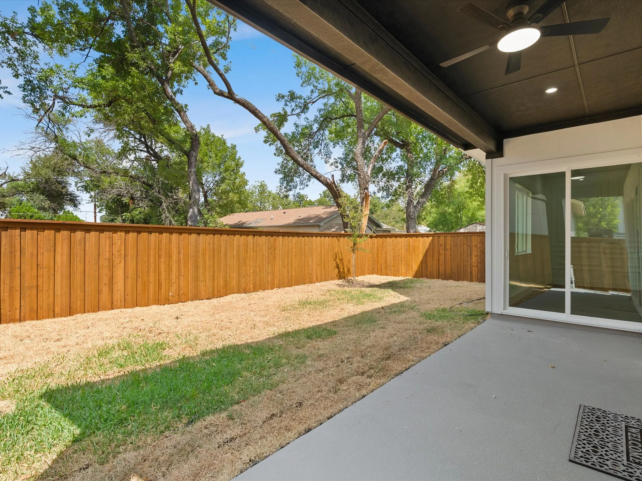 Covered patio with integrated ceiling fan and recessed lighting