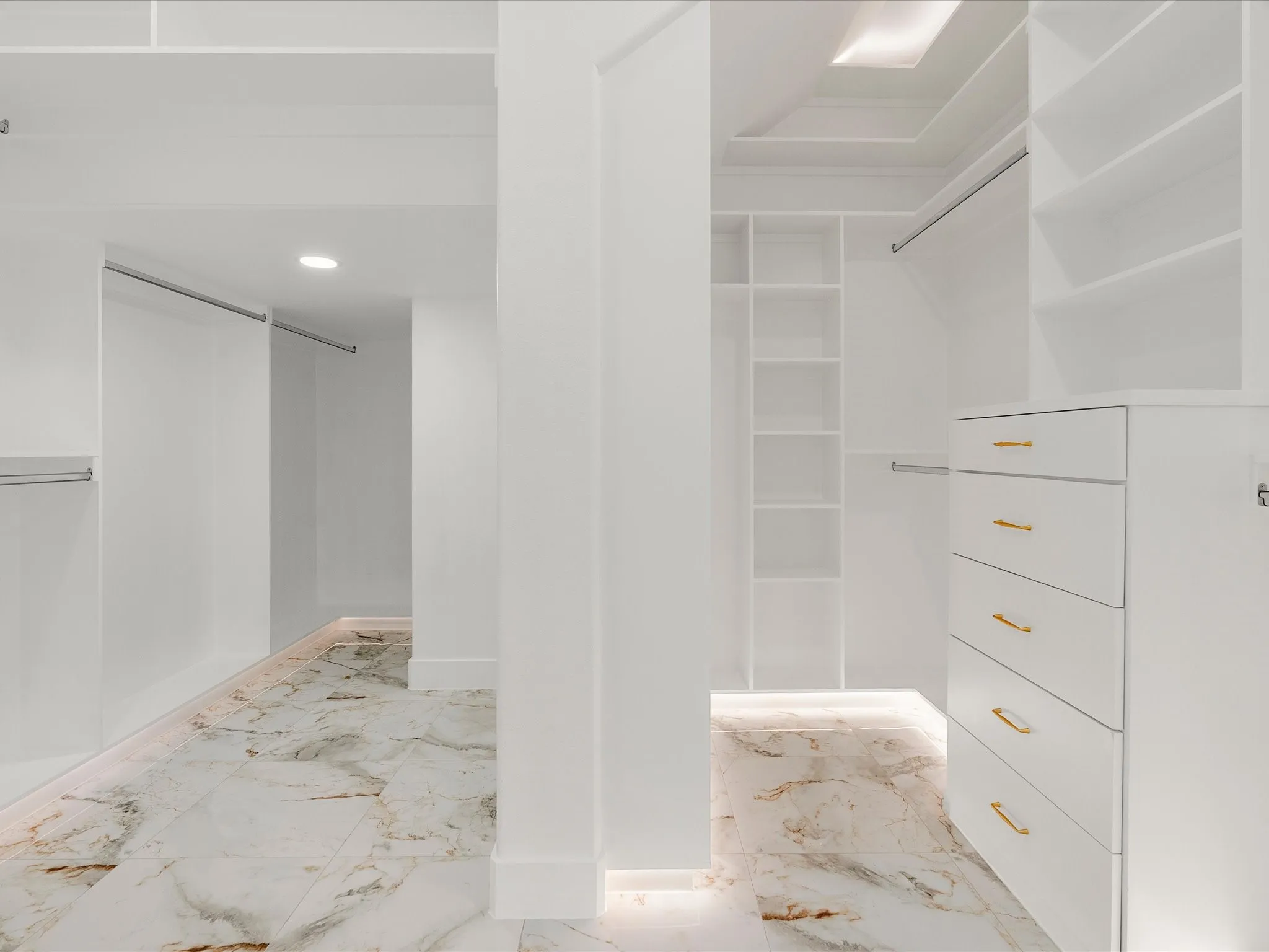 Custom closet system featuring built-in shelving, drawers with gold-toned hardware, under led lighting and recessed ceiling lighting.