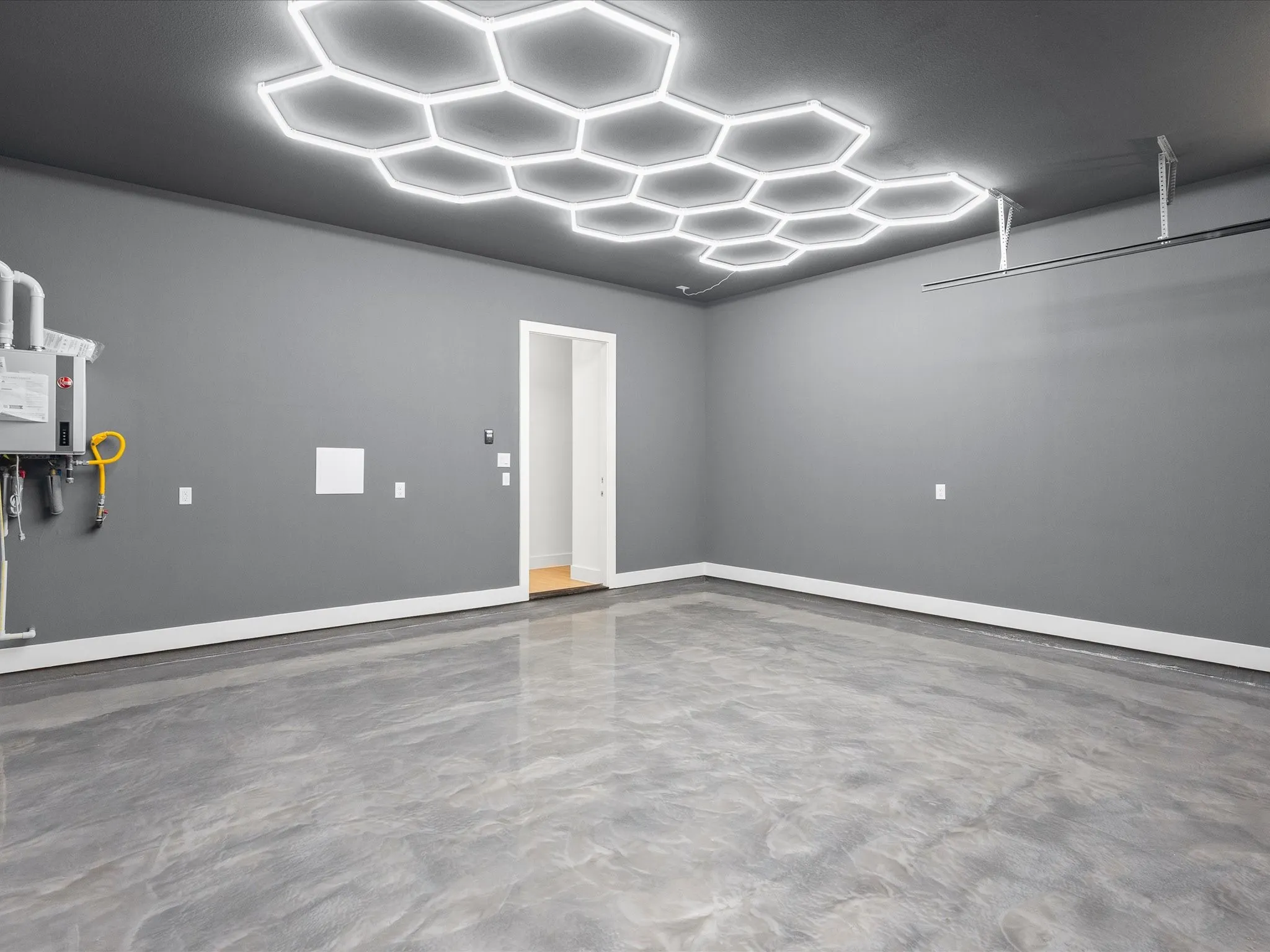 Hexagonal ceiling lighting fixtures,  and epoxy flooring.