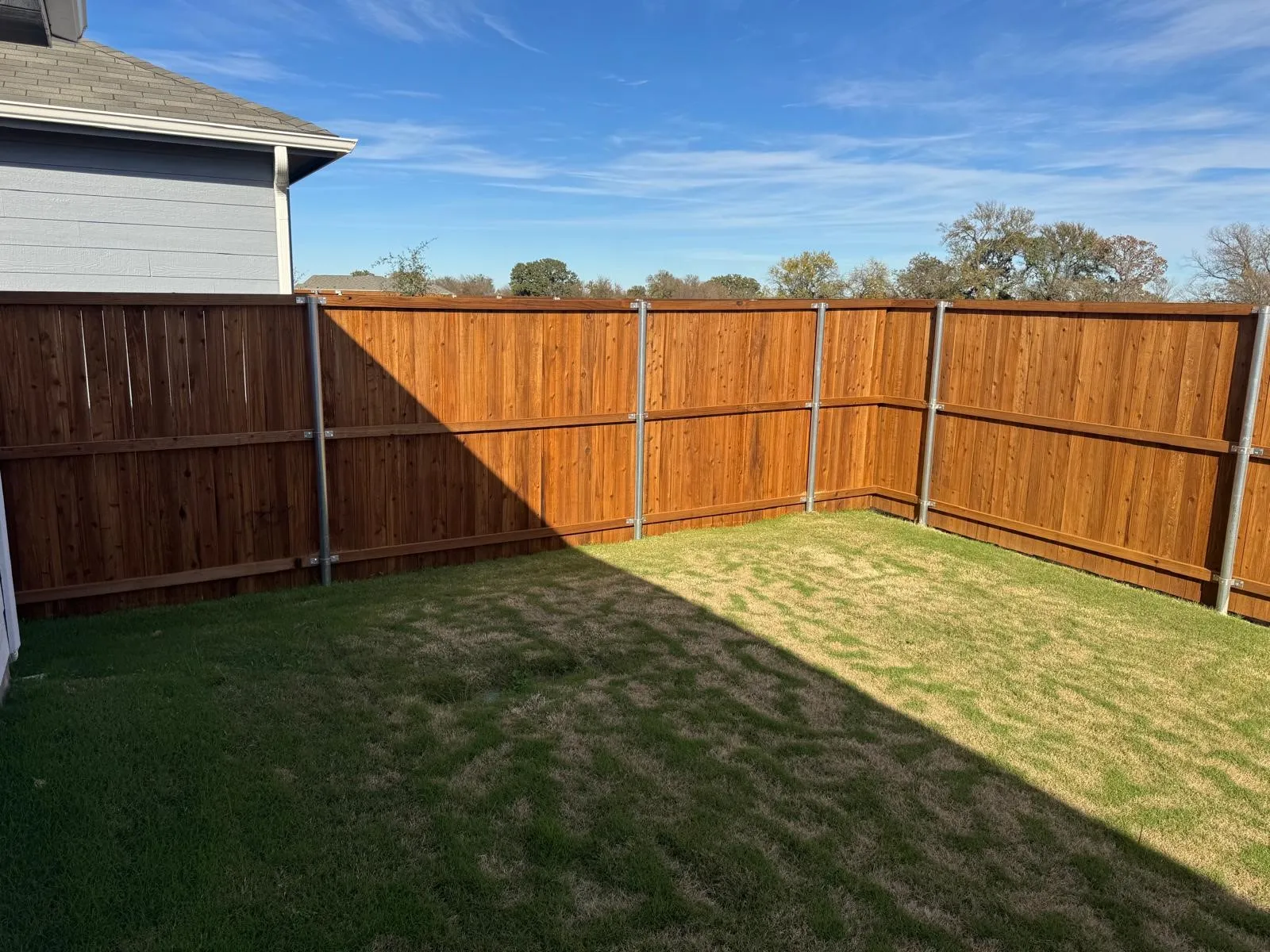 View of fenced backyard