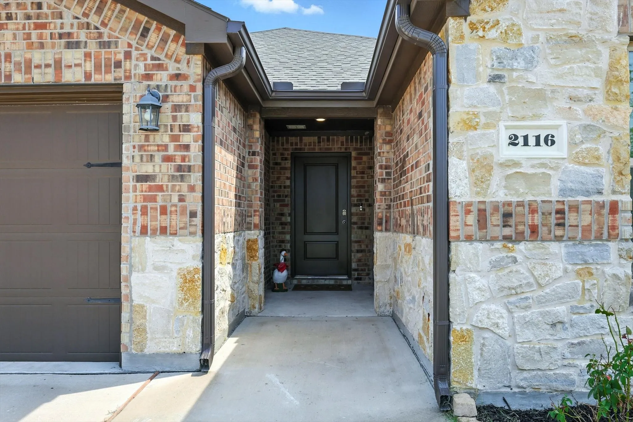 Brick and stone exterior with dark trim