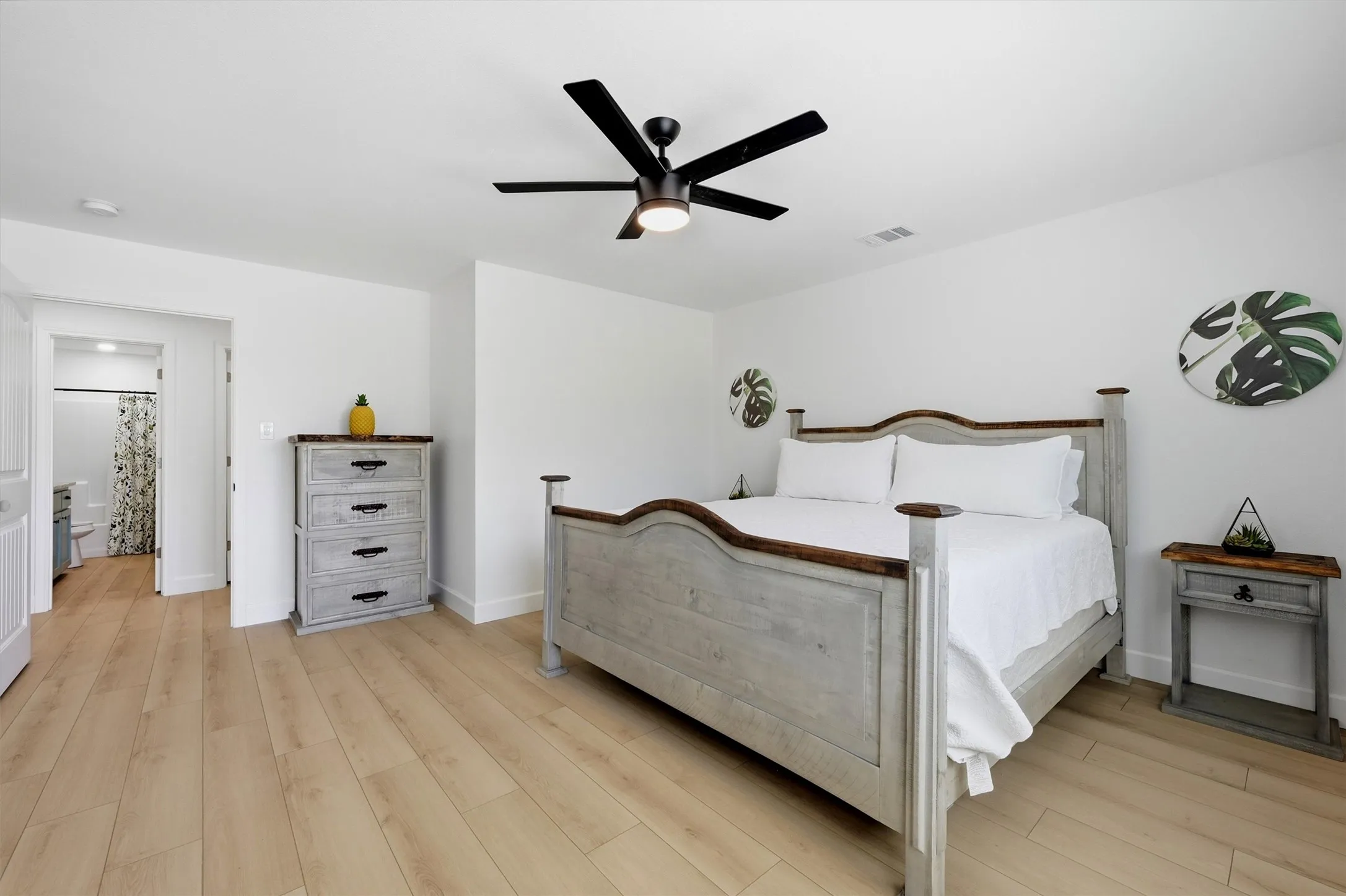 Recessed lighting with a ceiling fan, light wood-finish flooring, and white walls