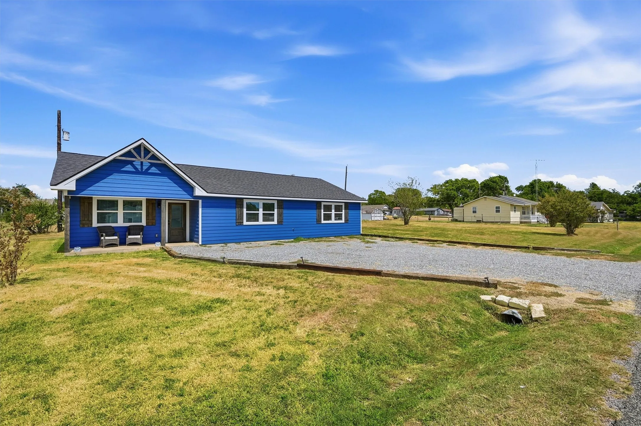 Blue exterior siding with white trim