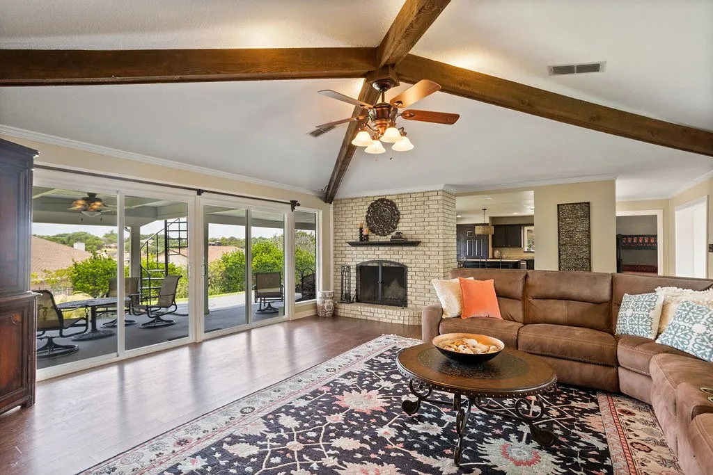 View of patio and wood burning fireplace