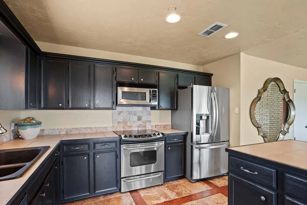 Stainless Steel appliances and plenty of counter space and storage