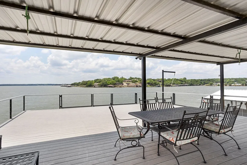 Large, high quality deck with dining area and plenty of room for a party. Gates open up for an un-obstructed view of the lake, jump off if you dare!