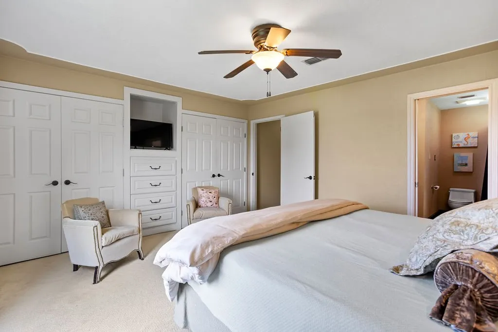 Primary Bedroom features 2 spacious closets, built in drawers, TV nook.