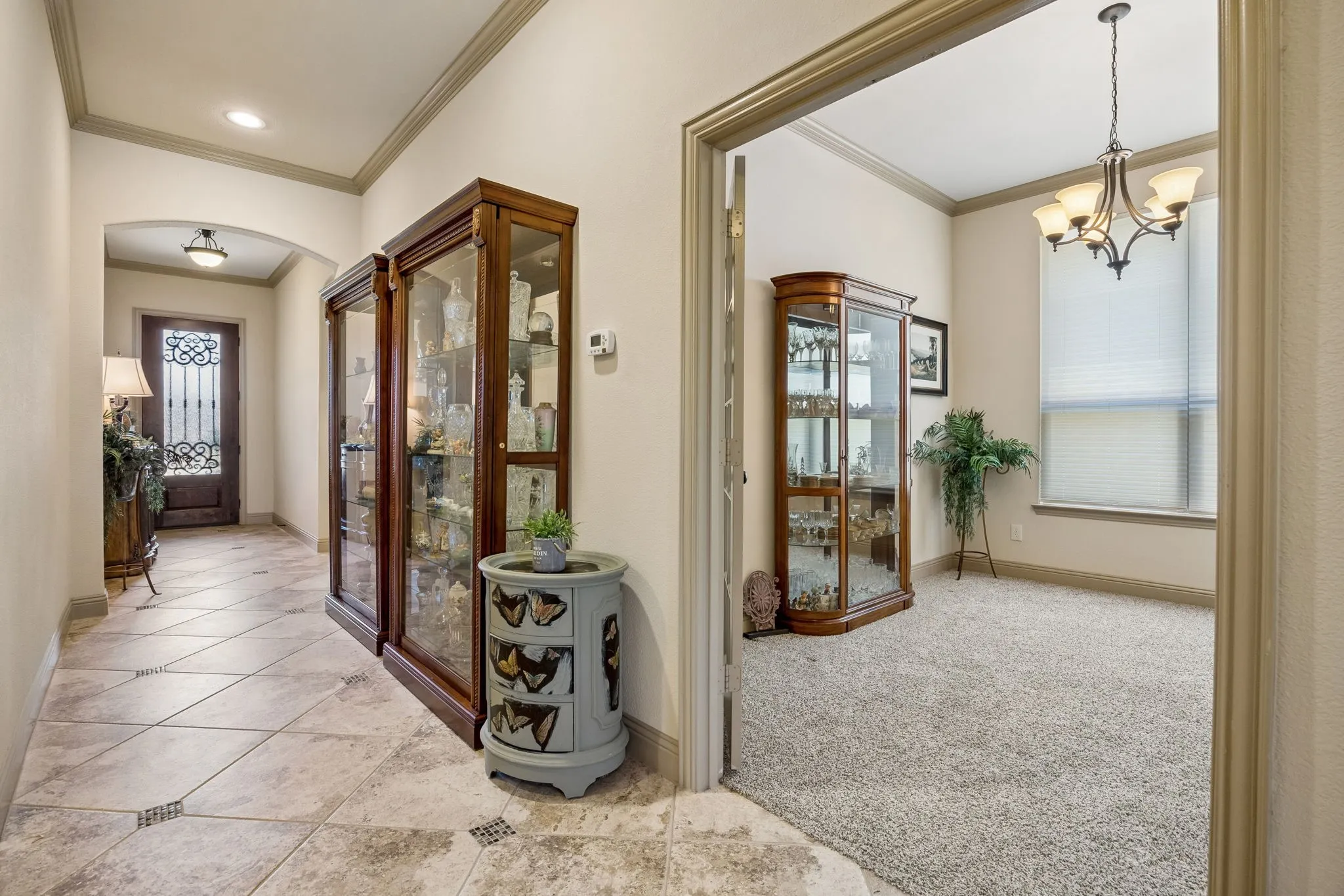 Tiled hallway flooring with an arched doorway