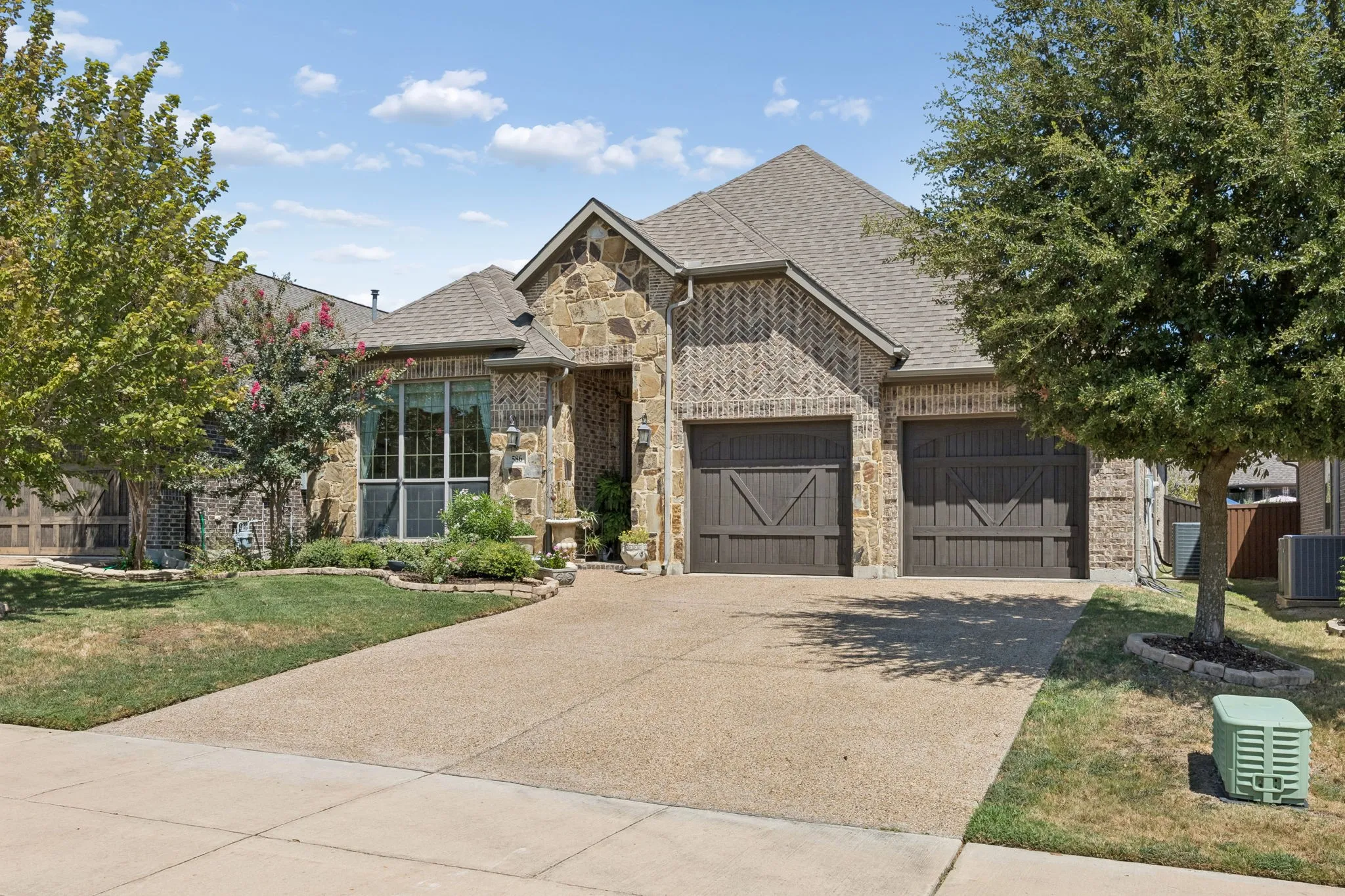 Stone and brick facade with a gabled roof