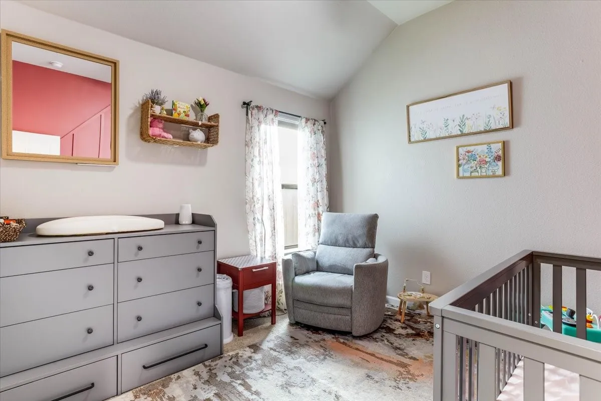 Vaulted ceiling with light wall paint, offering an expansive feel