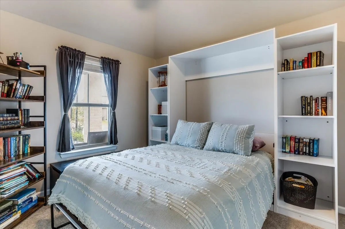 Single window opening, built-in shelving unit, and a built-in wall bed frame