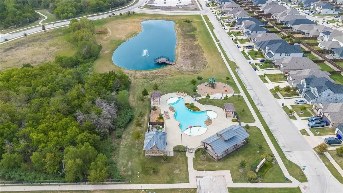 Community amenities featuring a swimming pool, playground, and pond