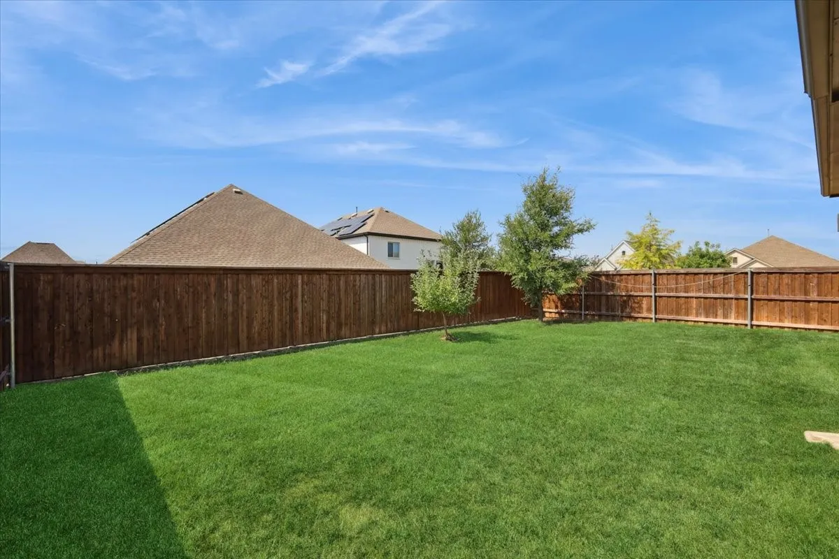 View of fenced backyard