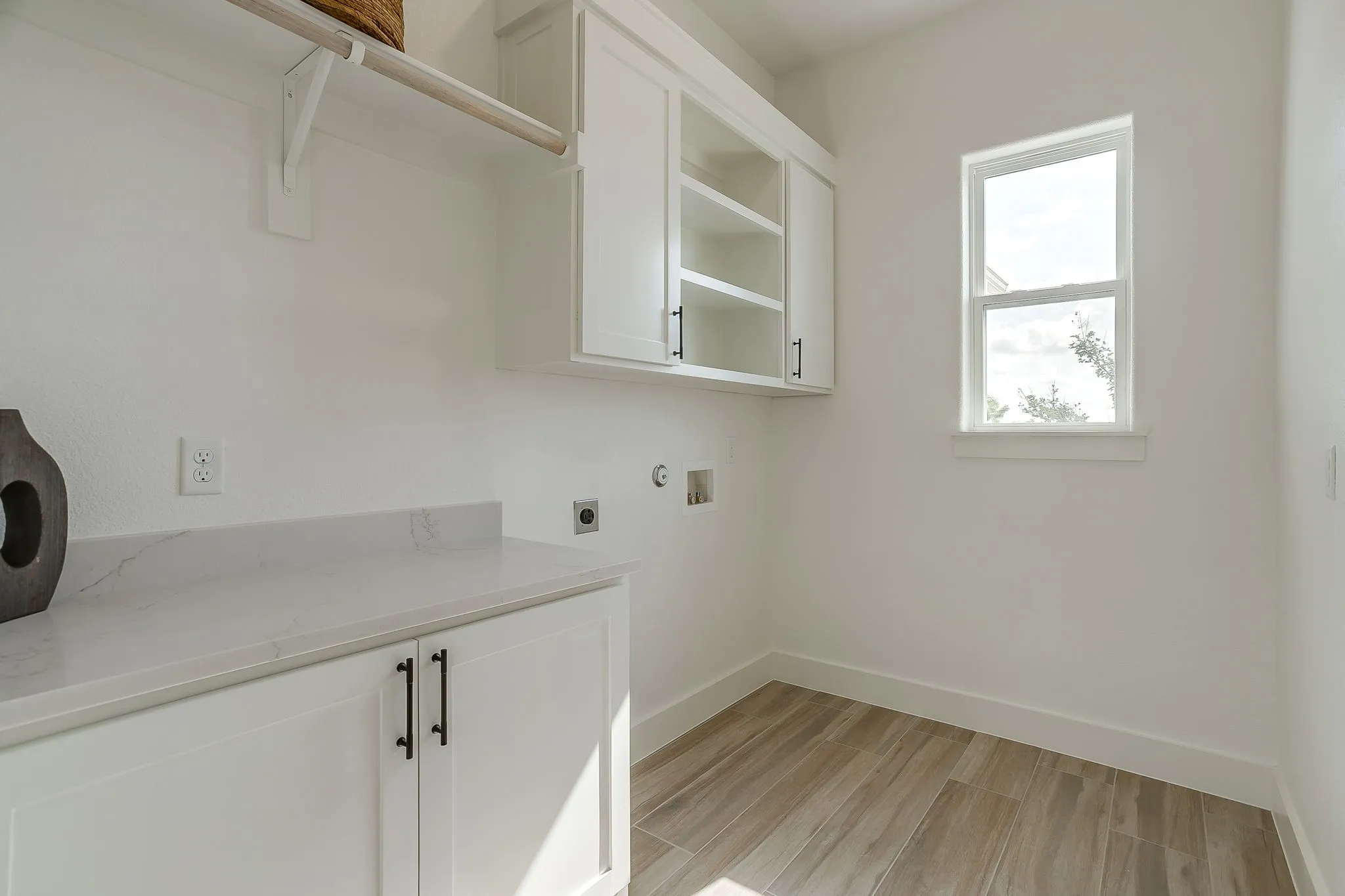 Oversized laundry room with pocket door