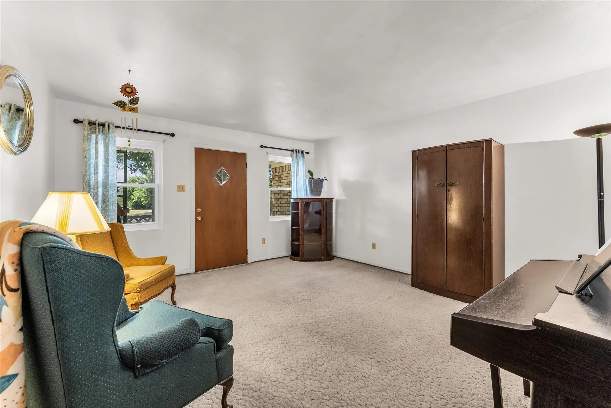 White walls complement carpeted flooring