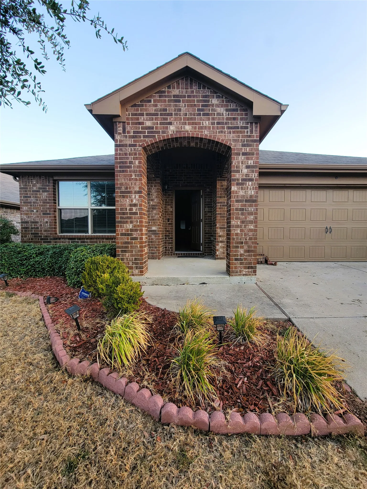 Brick exterior with an arched entry