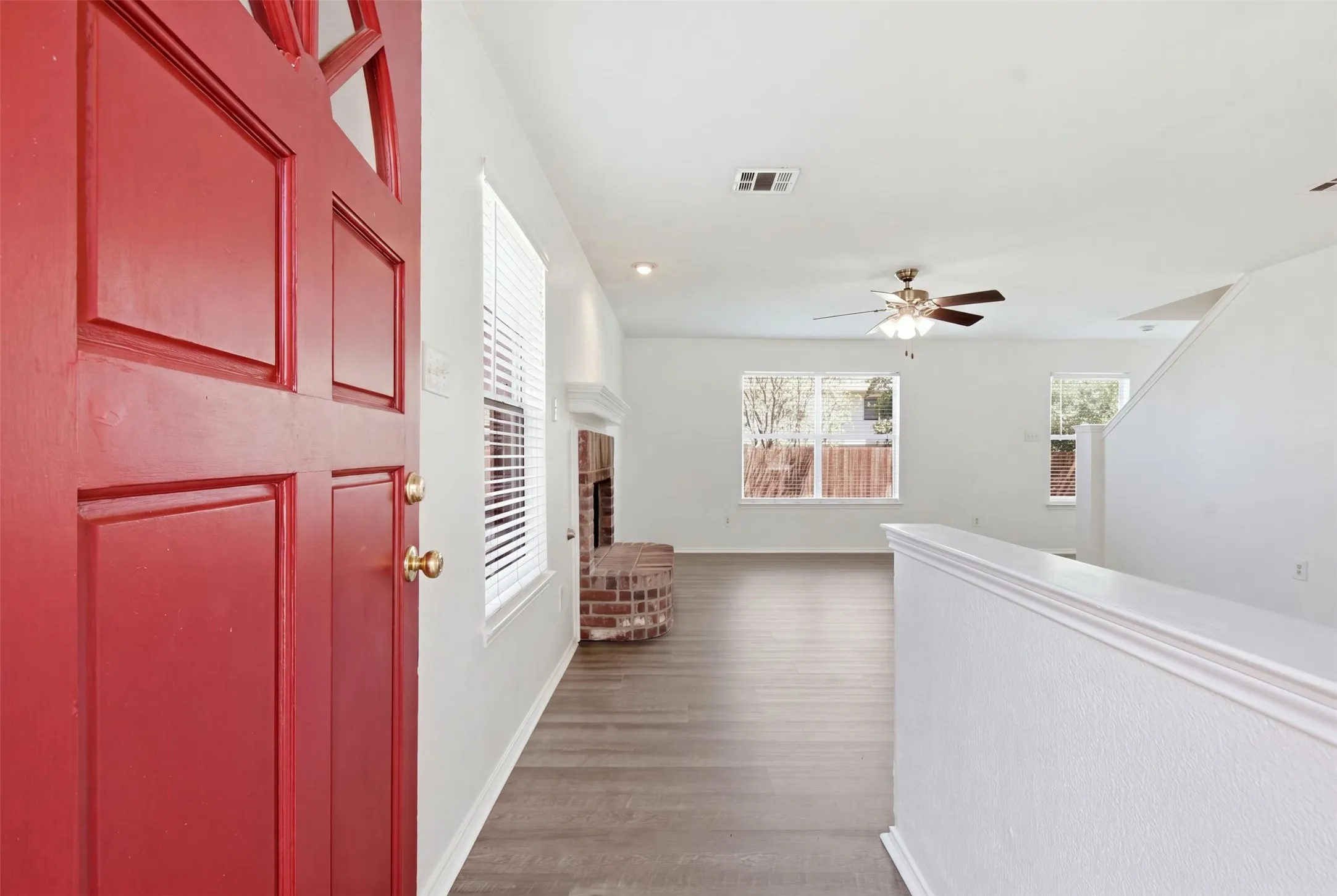 Step inside to this spacious living area featuring a cozy fireplace.