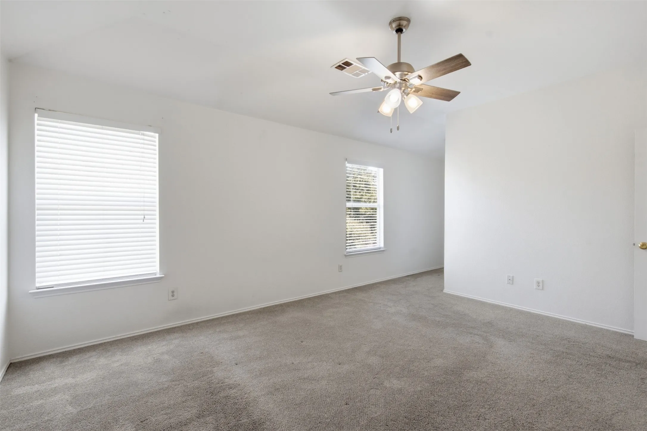 This spacious and light-filled primary bedroom suite is conveniently situated on the second level of the home, positioned in close proximity to the additional secondary bedrooms to offer both functional living arrangements and added peace of mind for families with young children who prefer to be nearby.