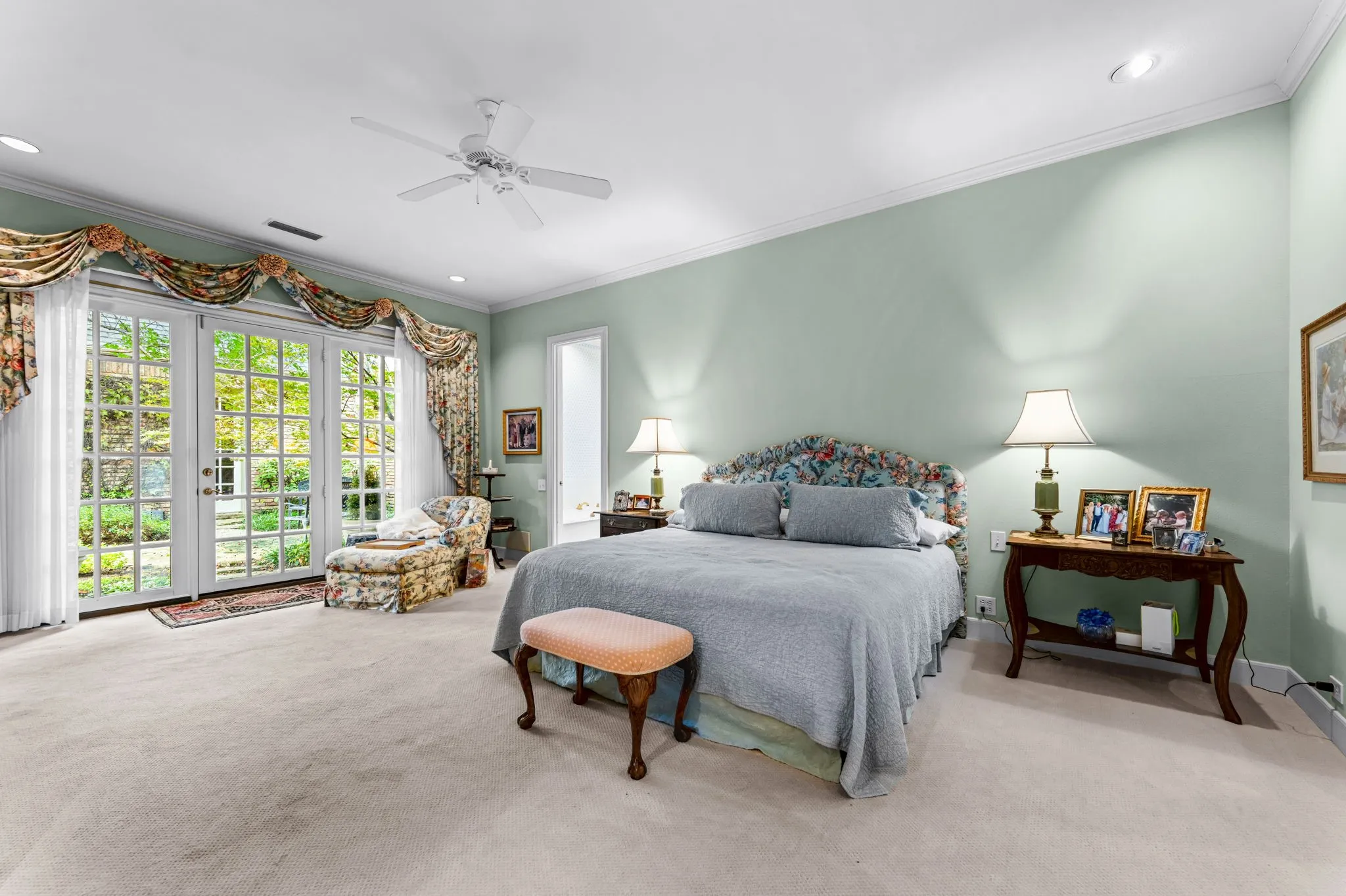 Carpeted room with double French doors, recessed lighting, crown molding, and a ceiling fan