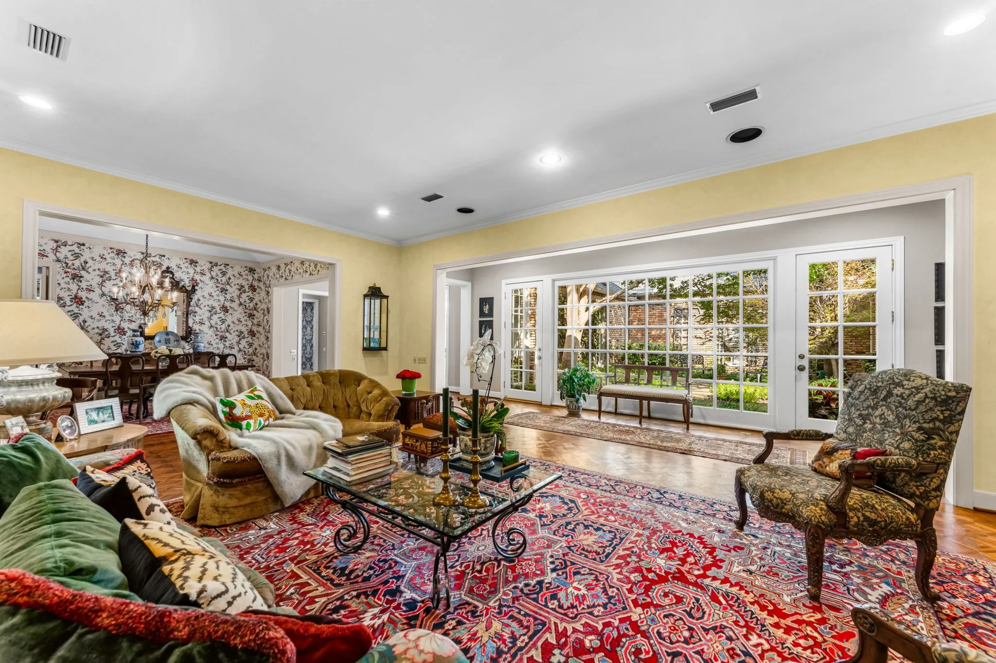 Hardwood flooring throughout, recessed lighting, and crown molding