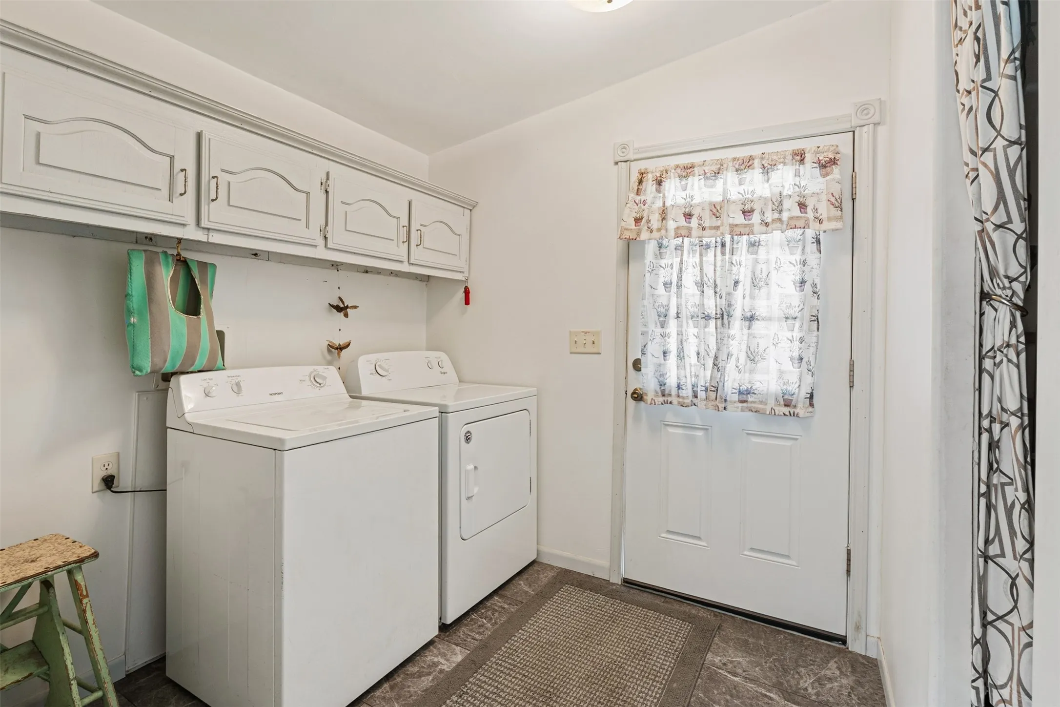 Large laundry room with storage
