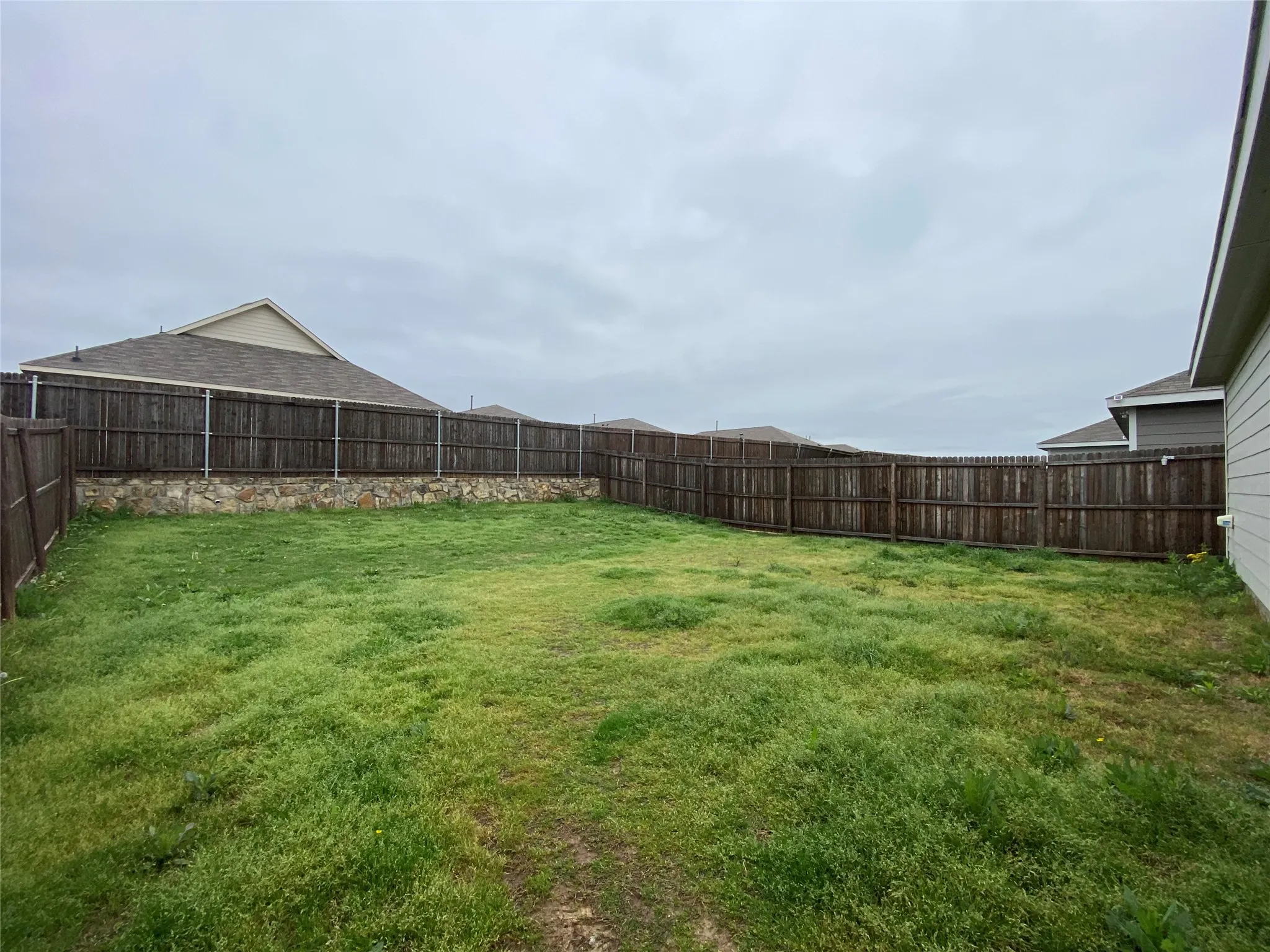 View of yard featuring a fenced backyard