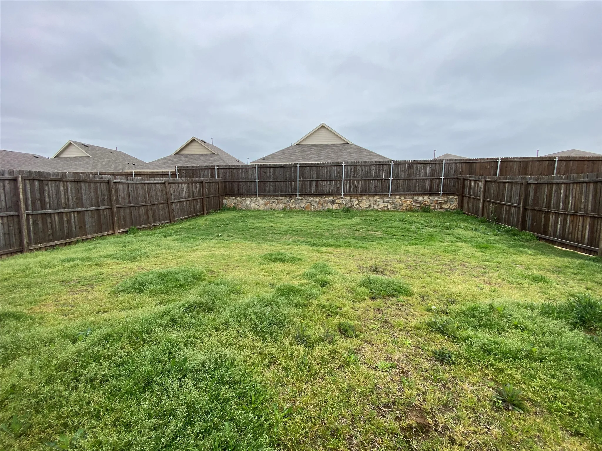 View of yard featuring a fenced backyard