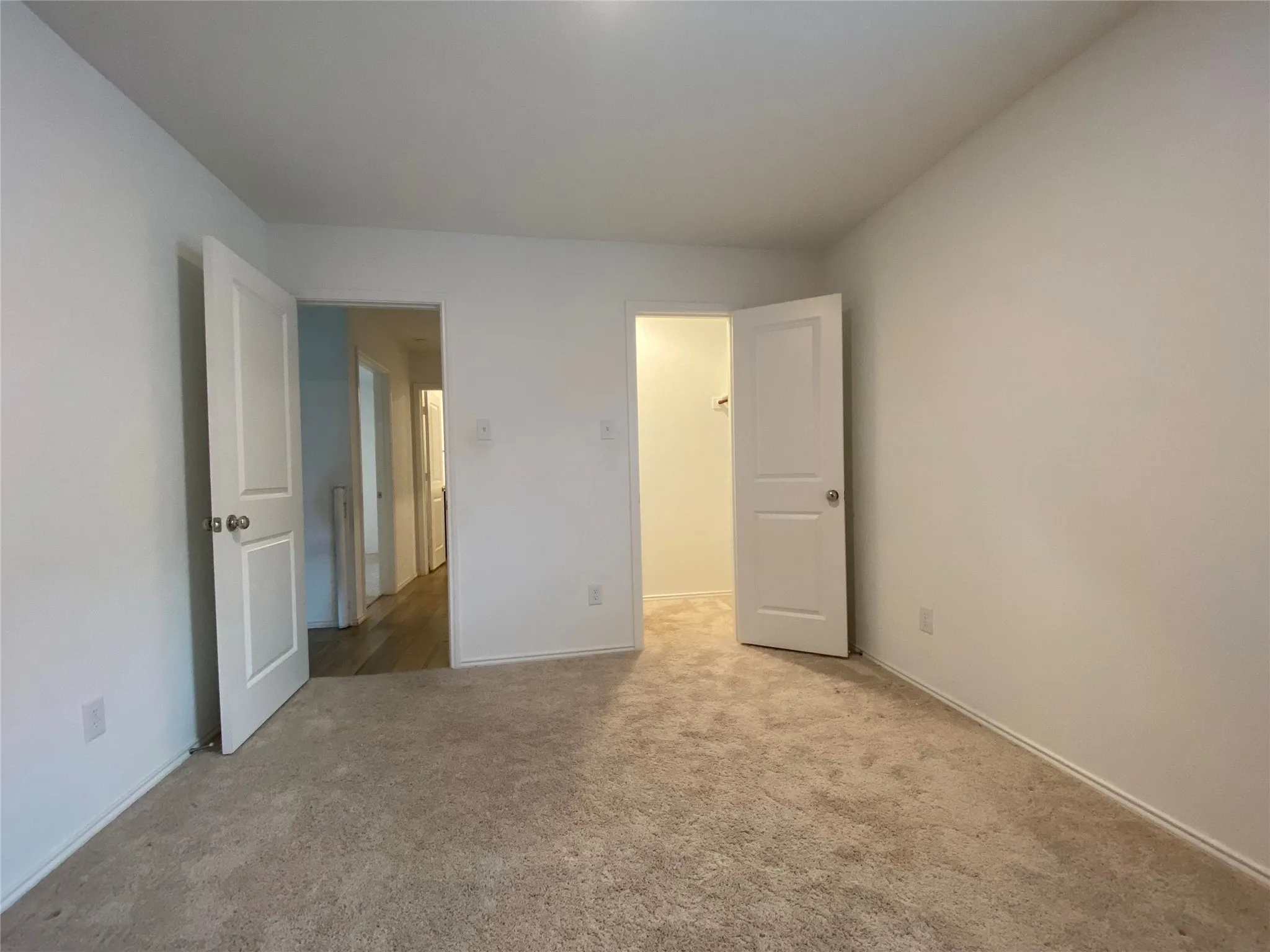 Unfurnished bedroom with carpet floors