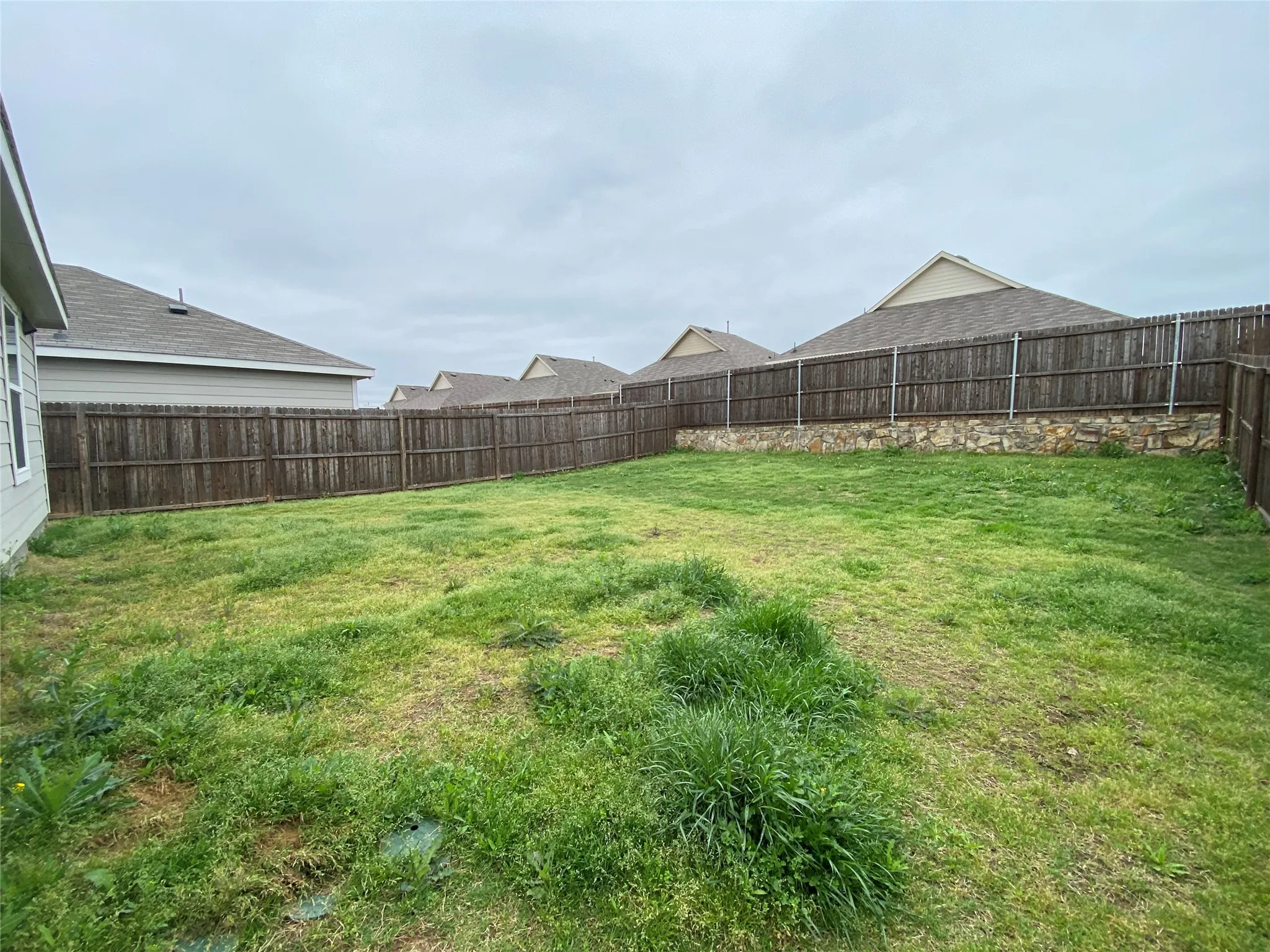 View of yard with a fenced backyard