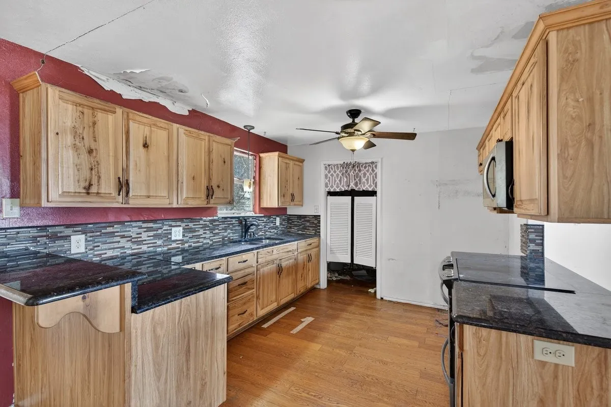 Kitchen has granite counter tops, updated cabinets and appliances.