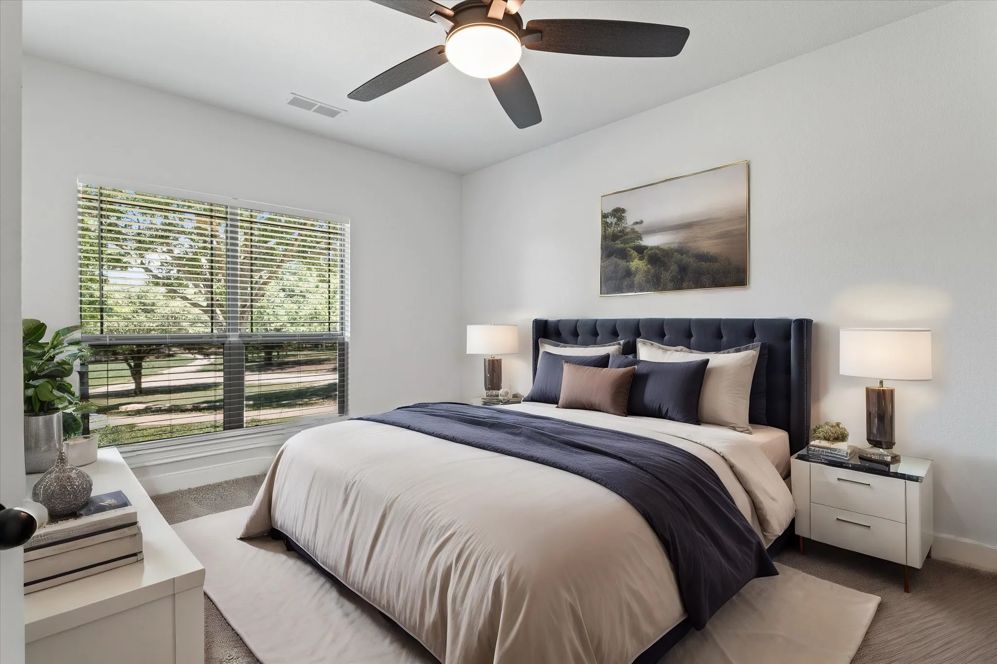 Recessed lighting, ceiling fan, expansive window with blinds, and light-toned walls